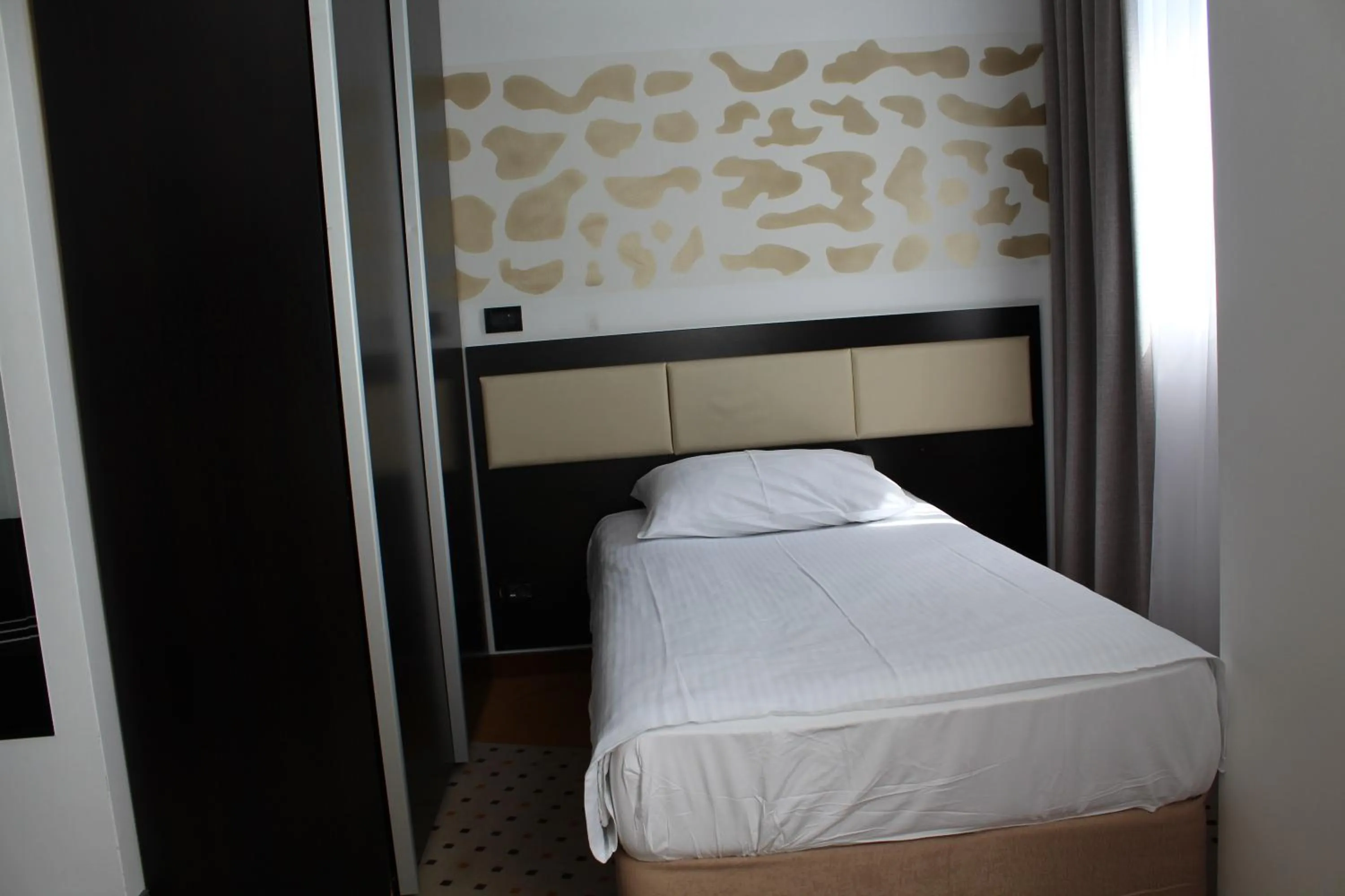 Bed in Hotel Diplomat
