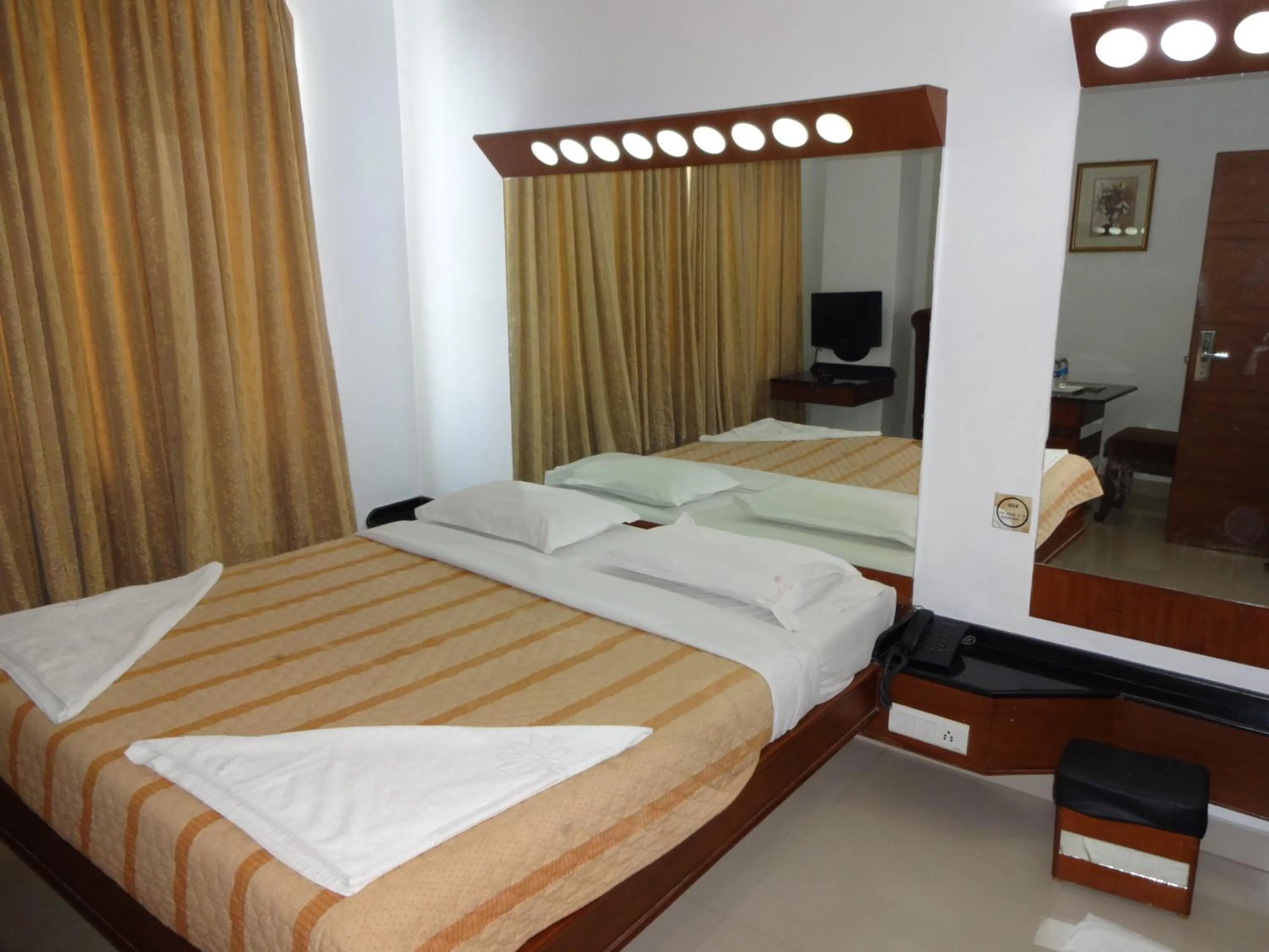 Photo of the whole room, Bed in Lotus Comfort - A Pondy Hotel