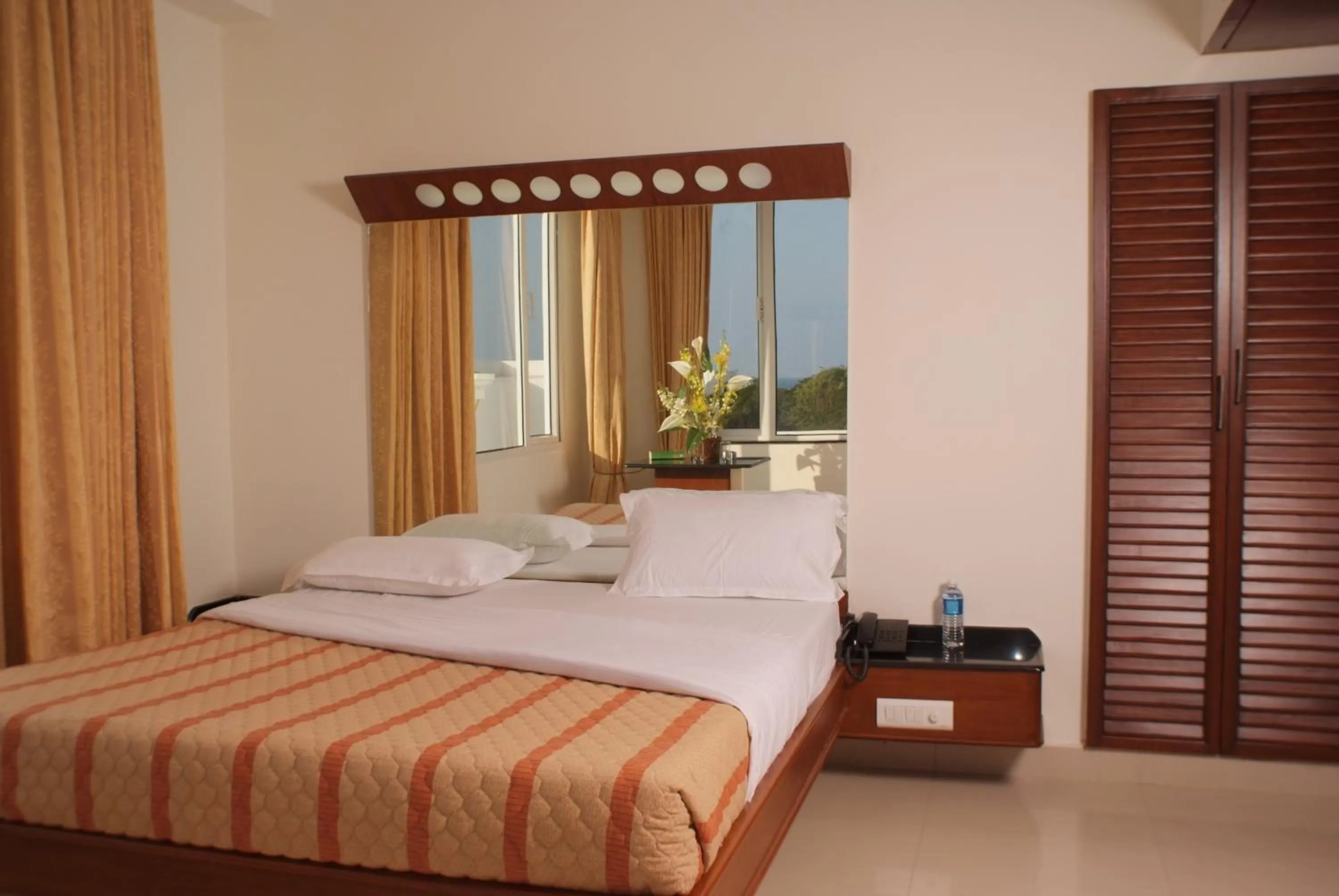 Bed in Lotus Comfort - A Pondy Hotel