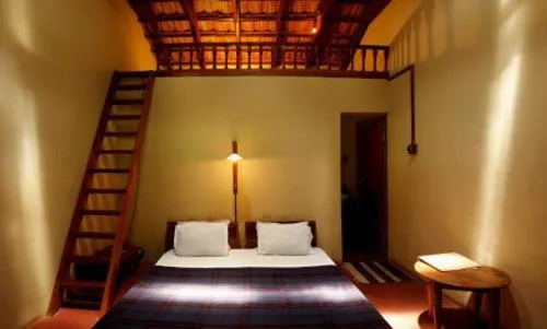 Bed in Elephant Valley Eco Farm Hotel