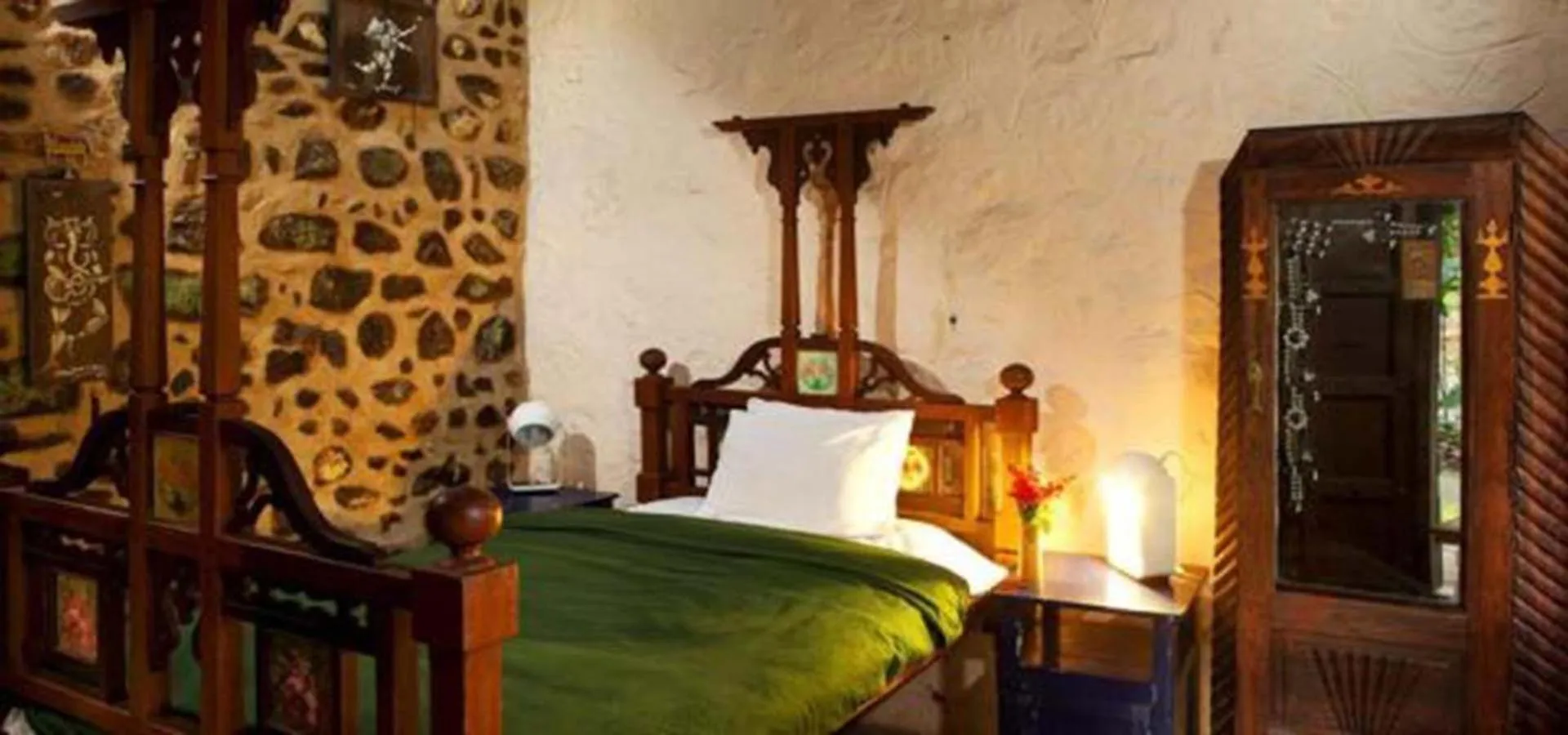 Bed in Elephant Valley Eco Farm Hotel