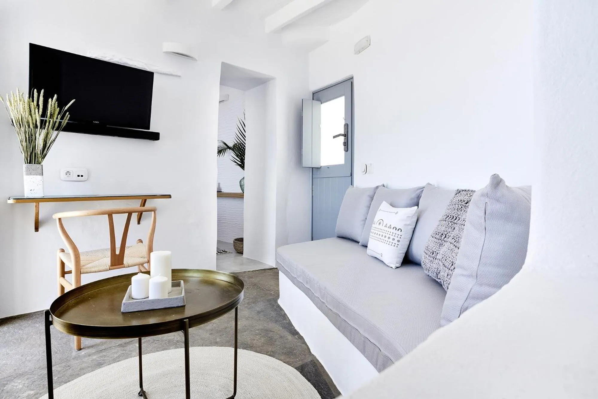 Seating area in Living Theros Luxury Suites