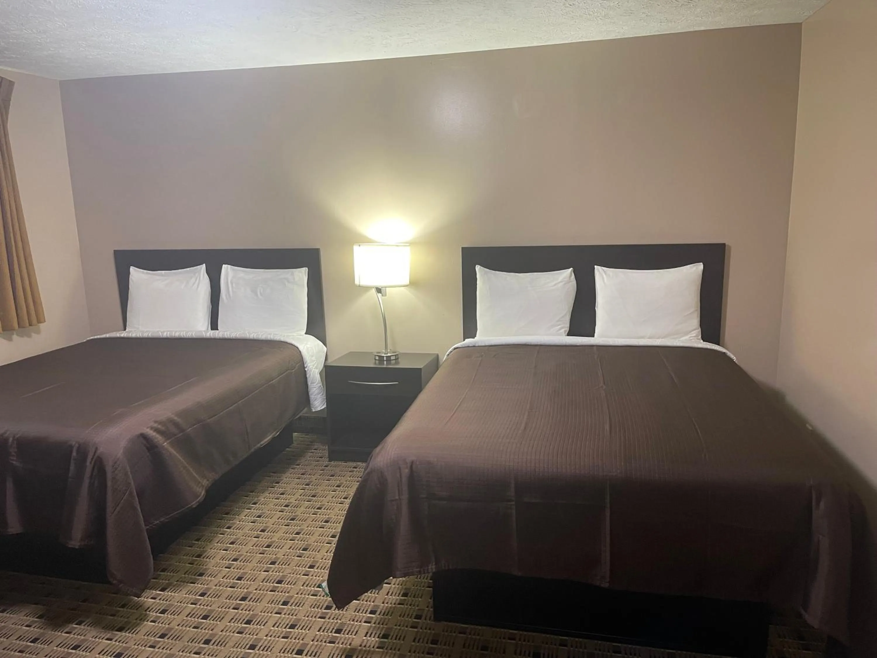 Bed in Economy Inn & Suites