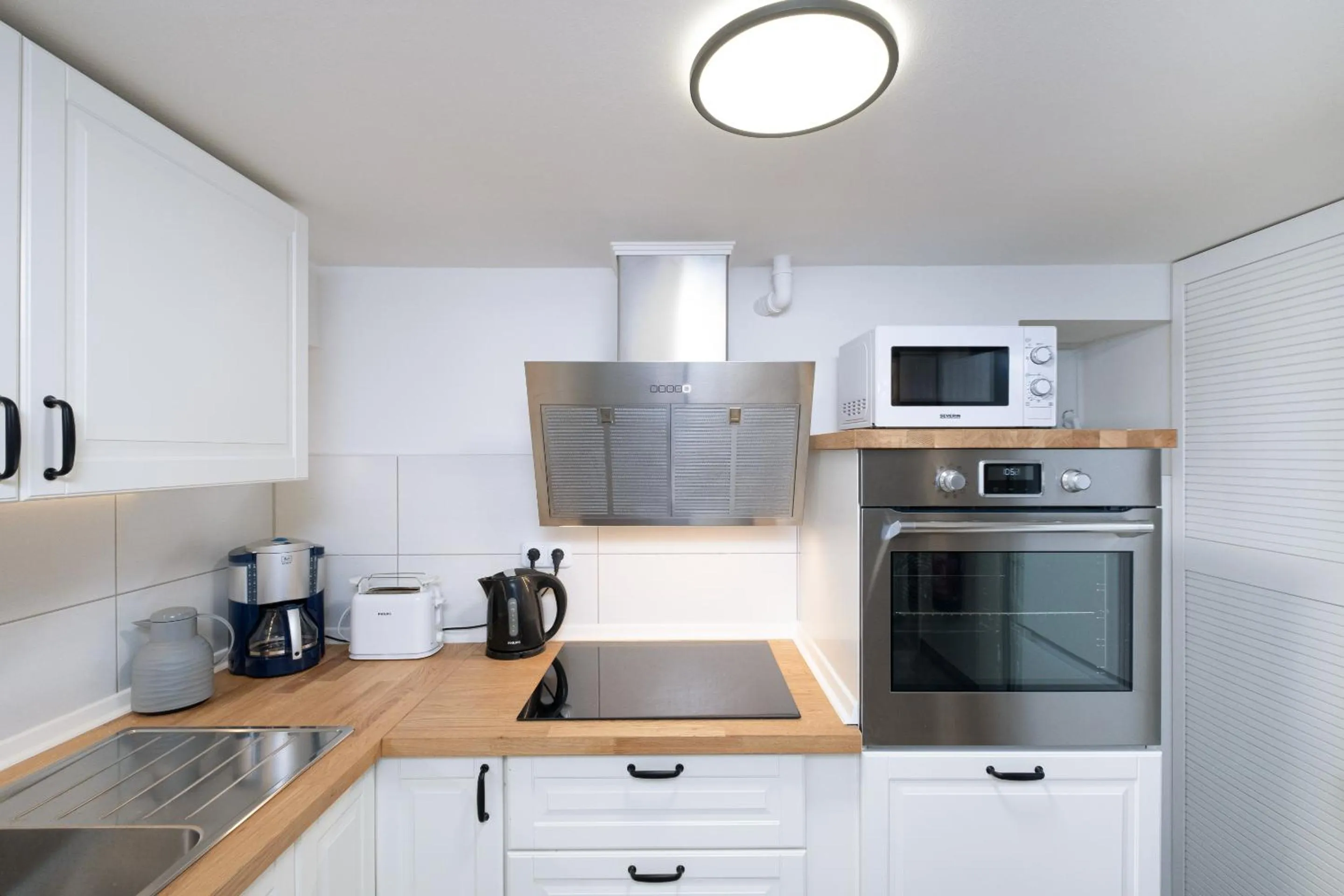 Kitchen or kitchenette in Gästehaus "Kleines Stadtidyll" -Zimmer und Apartments