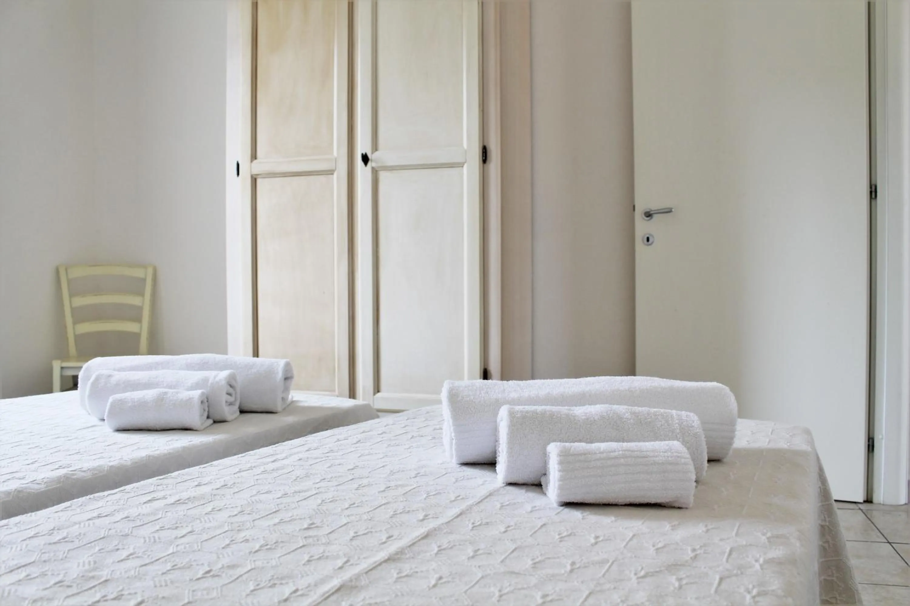 Bed in AHR Leonis Residence La Maddalena