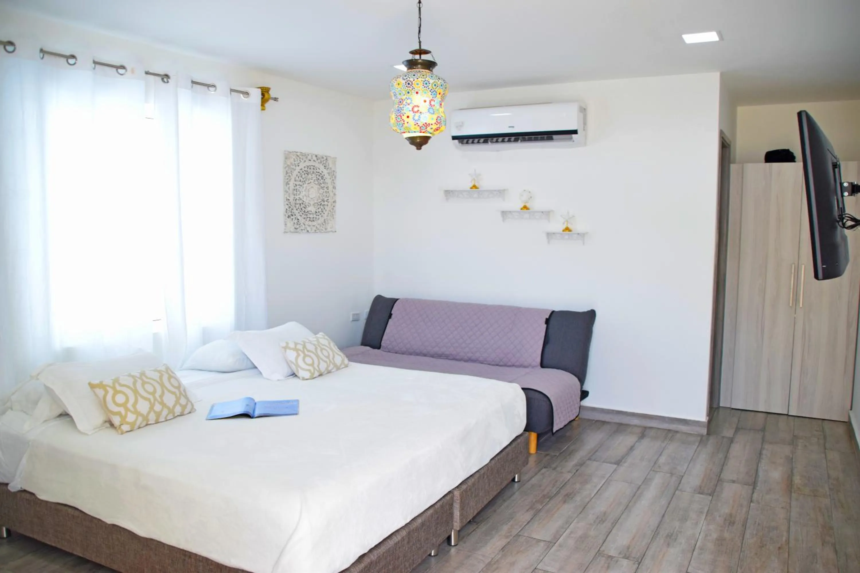 Bed in Le Castel Blanc Hotel Boutique