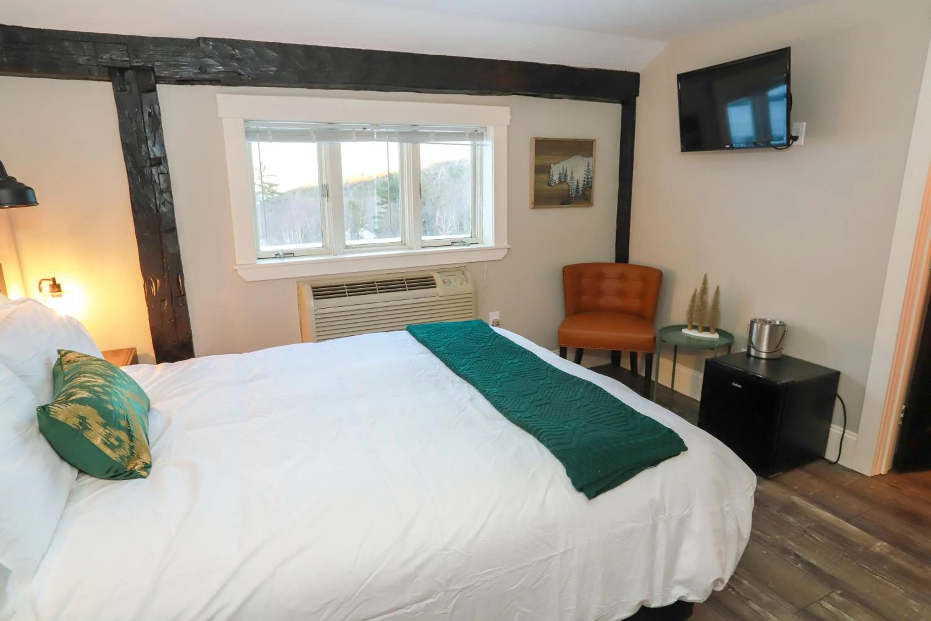Bed in Gunstock Inn & Suites