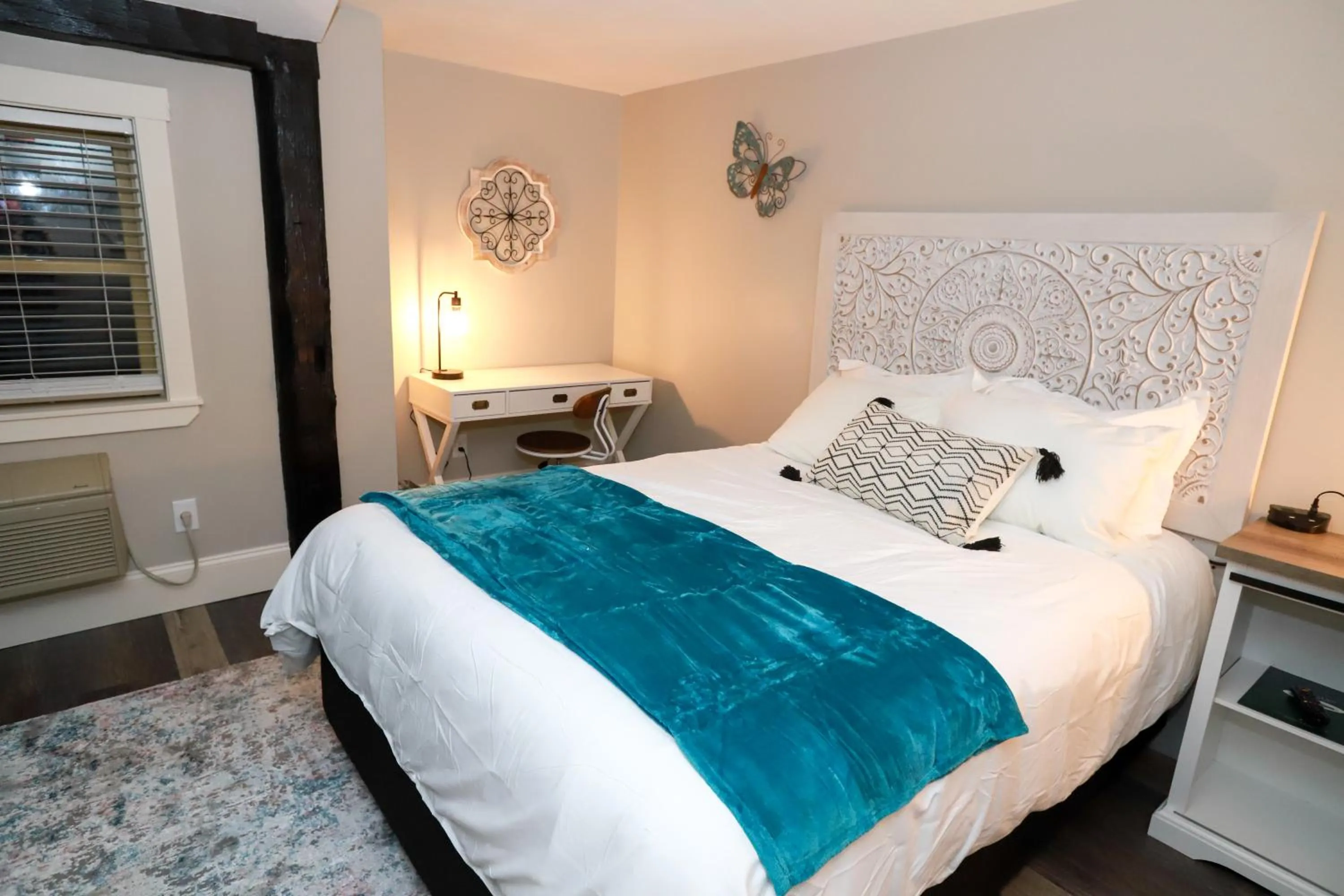 Bed in Gunstock Inn & Suites