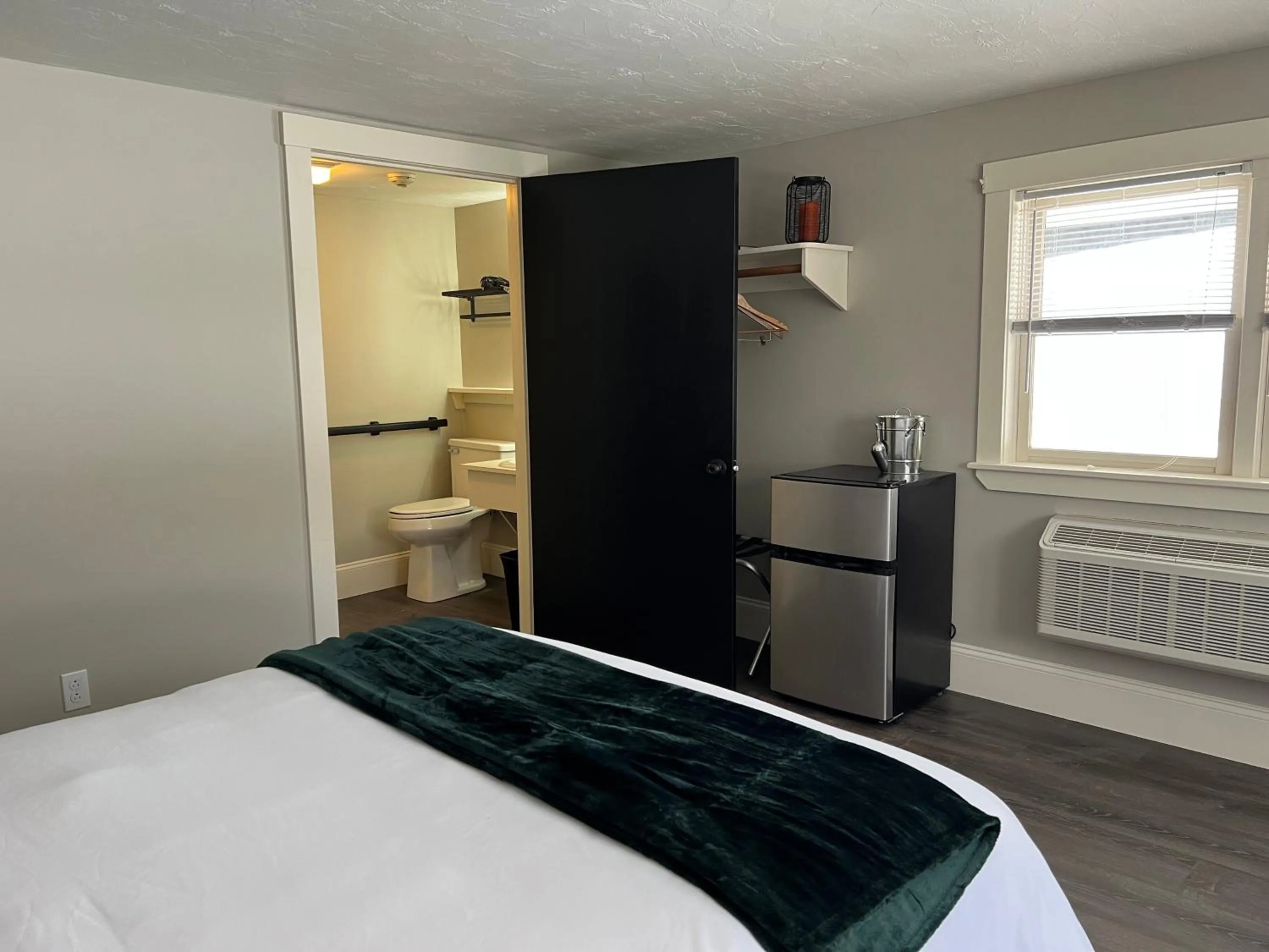 Bed in Gunstock Inn & Suites