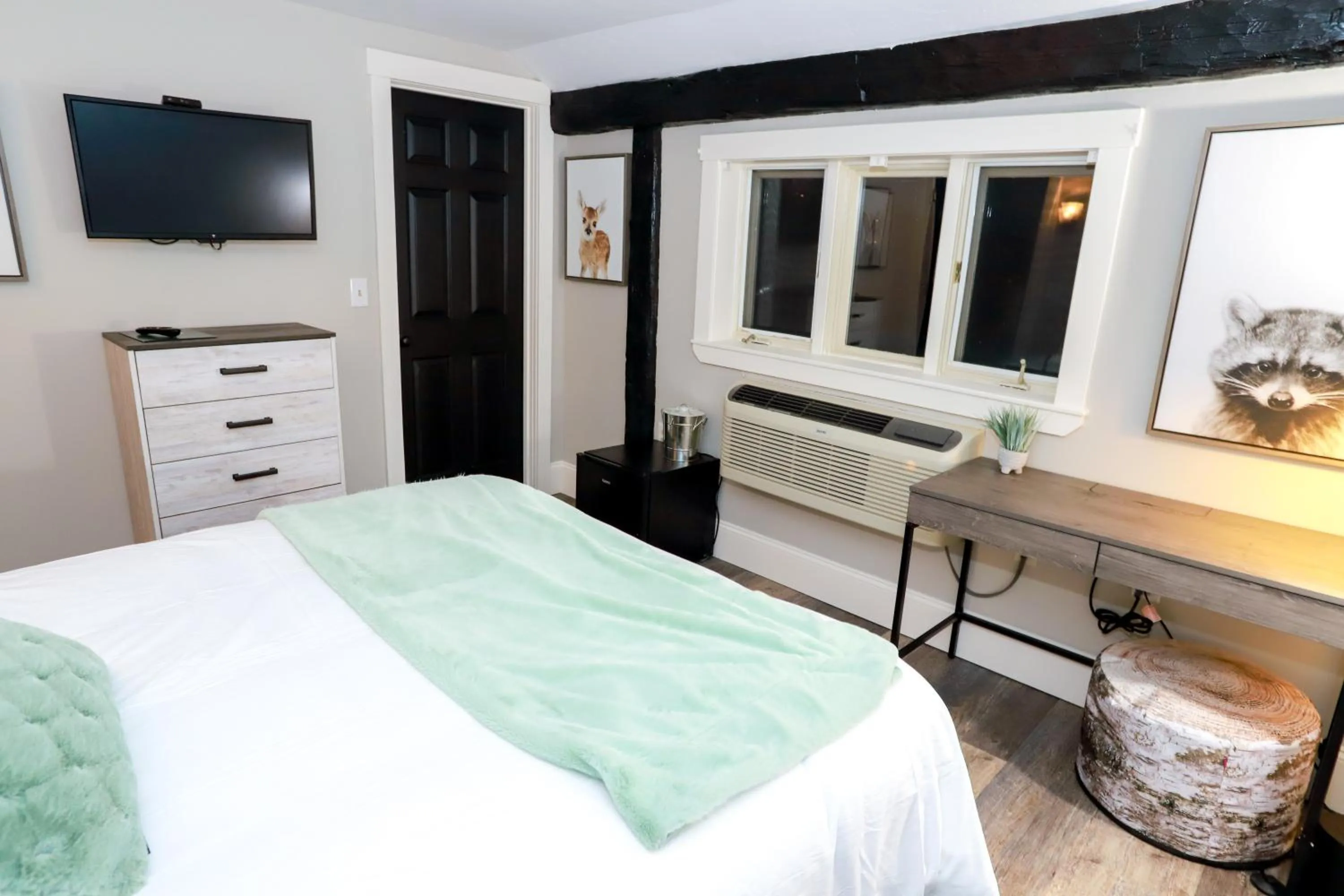 Bed in Gunstock Inn & Suites