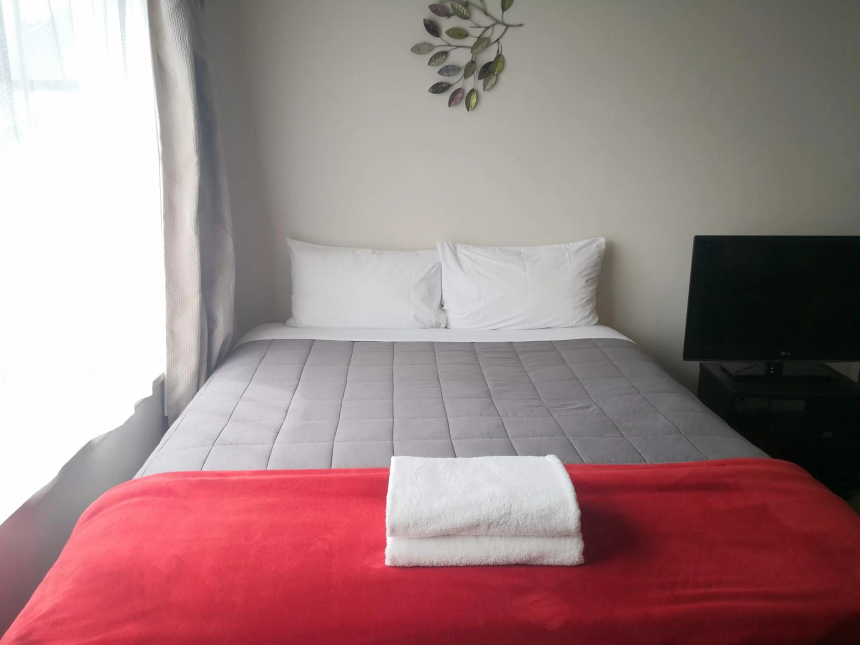 Bed in Southern Comfort Motel