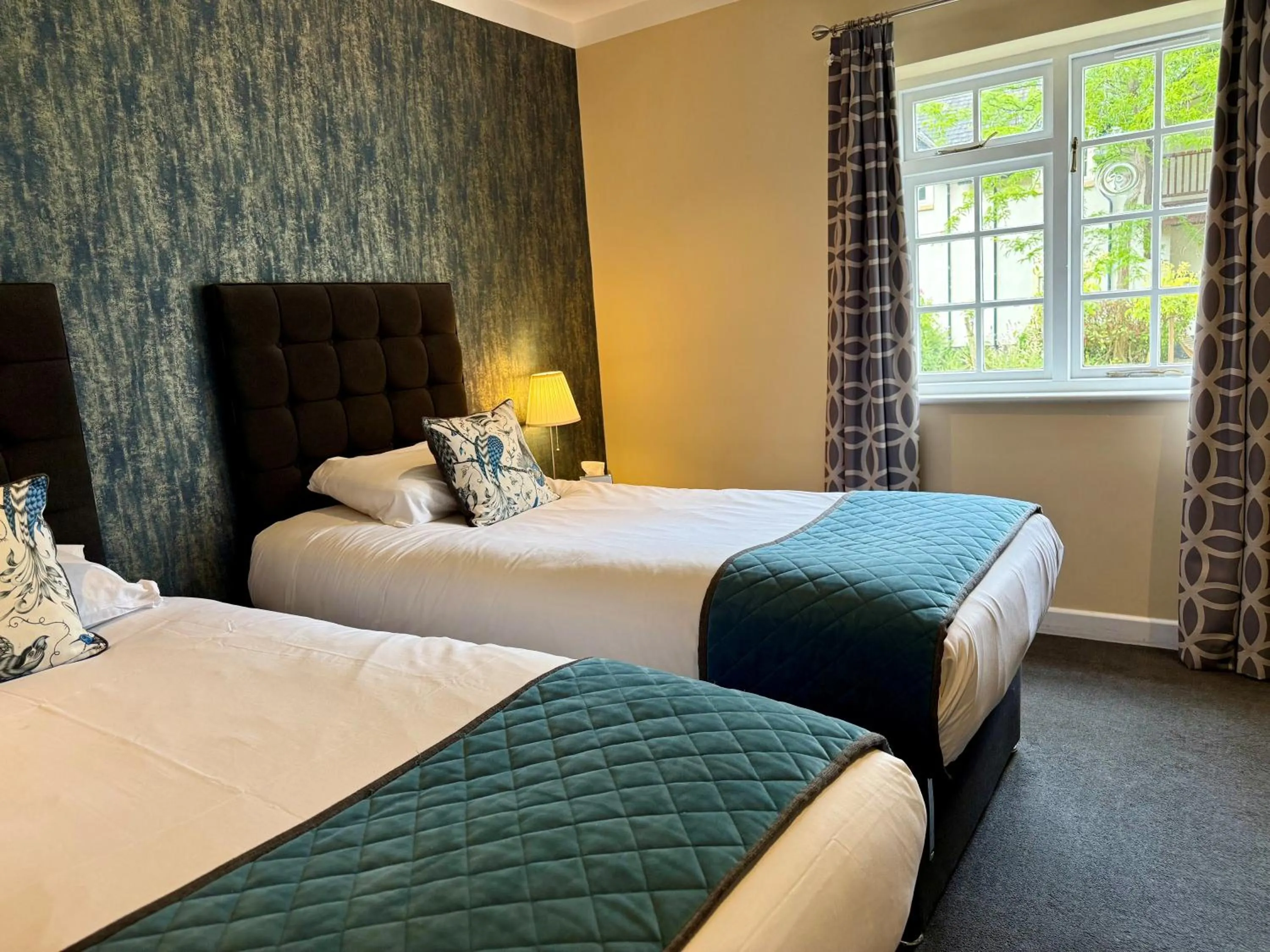 Bed in Wild Pheasant Hotel & Spa