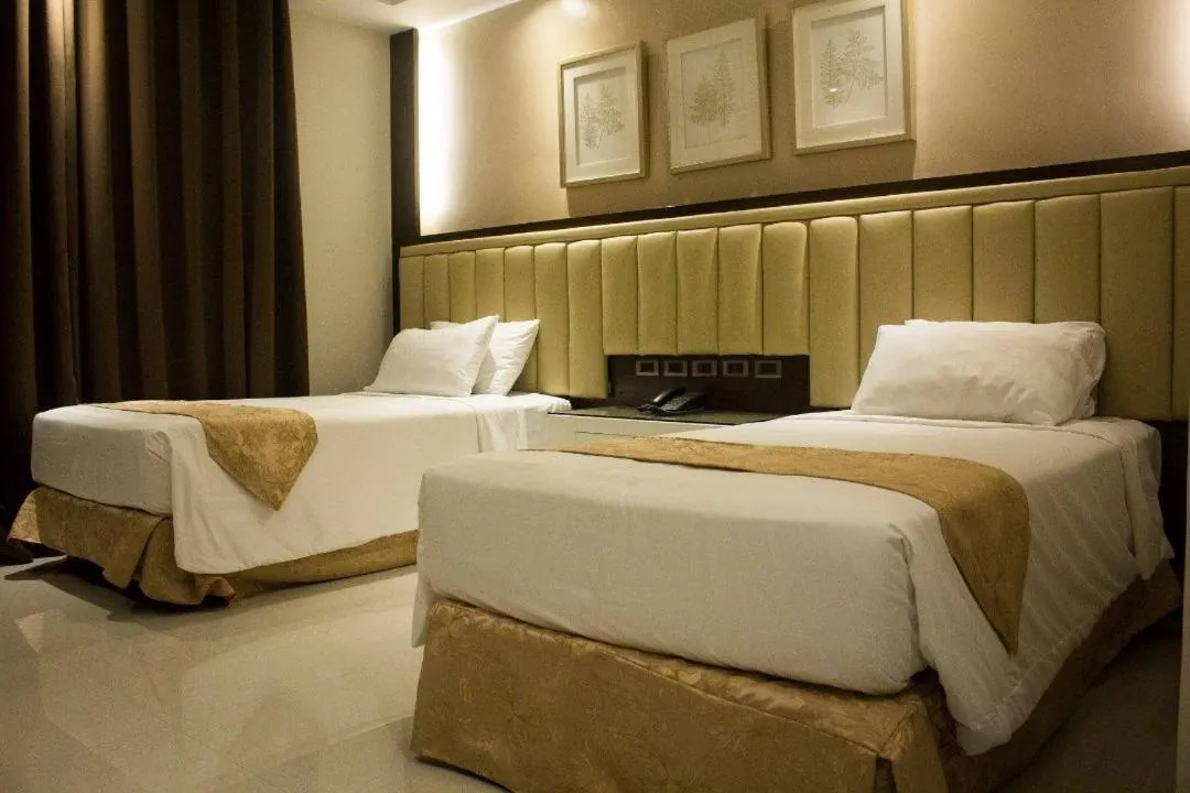 Bed in Crown Royale Hotel