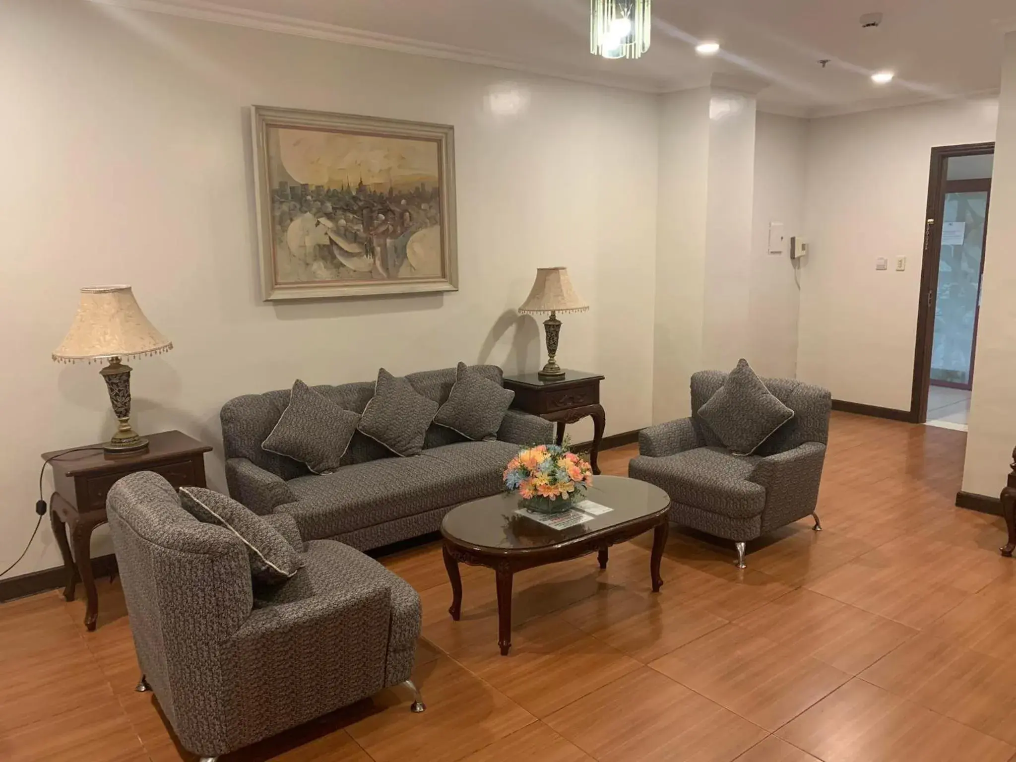 Living room in Crown Royale Hotel Living room in Crown Royale Hotel