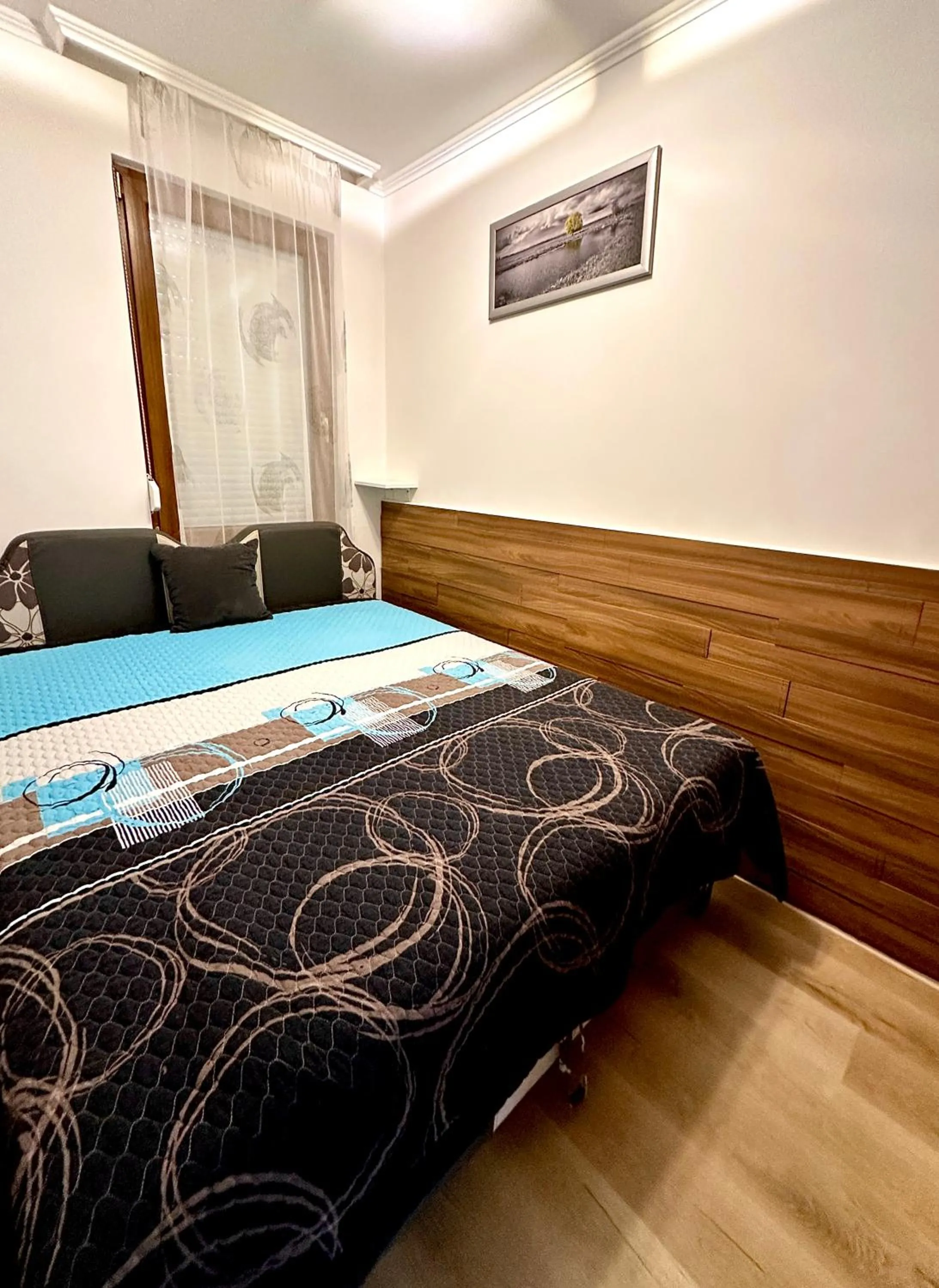 Bed in Dorina Wellness Apartman