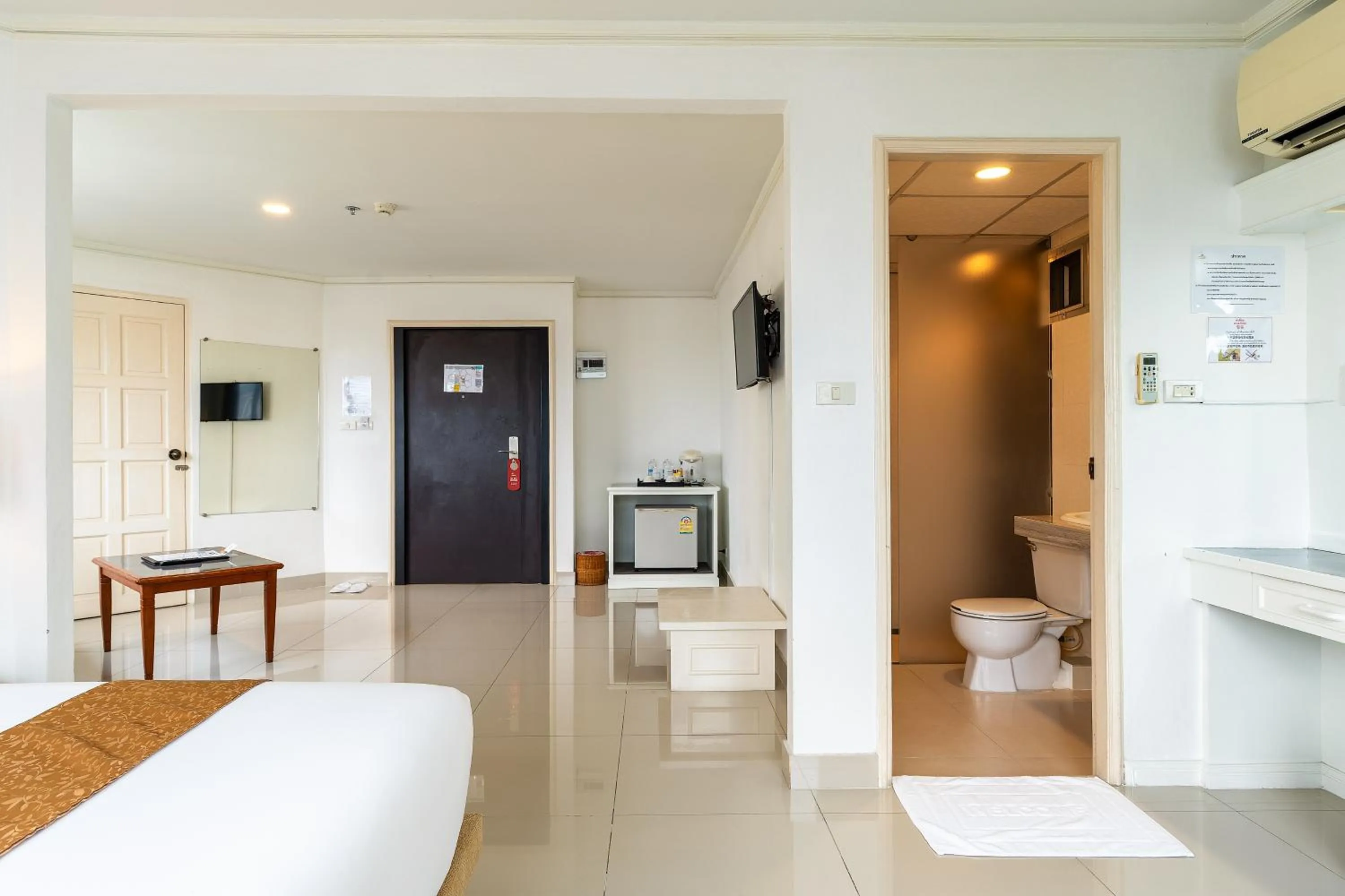 Toilet, Bed in Summit Pavilion Hotel