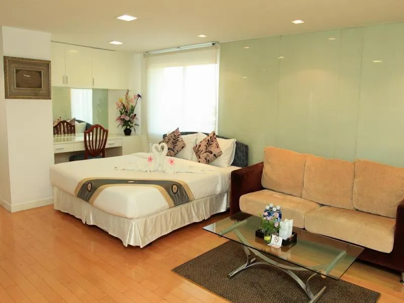 Seating area, Bed in Summit Pavilion Hotel