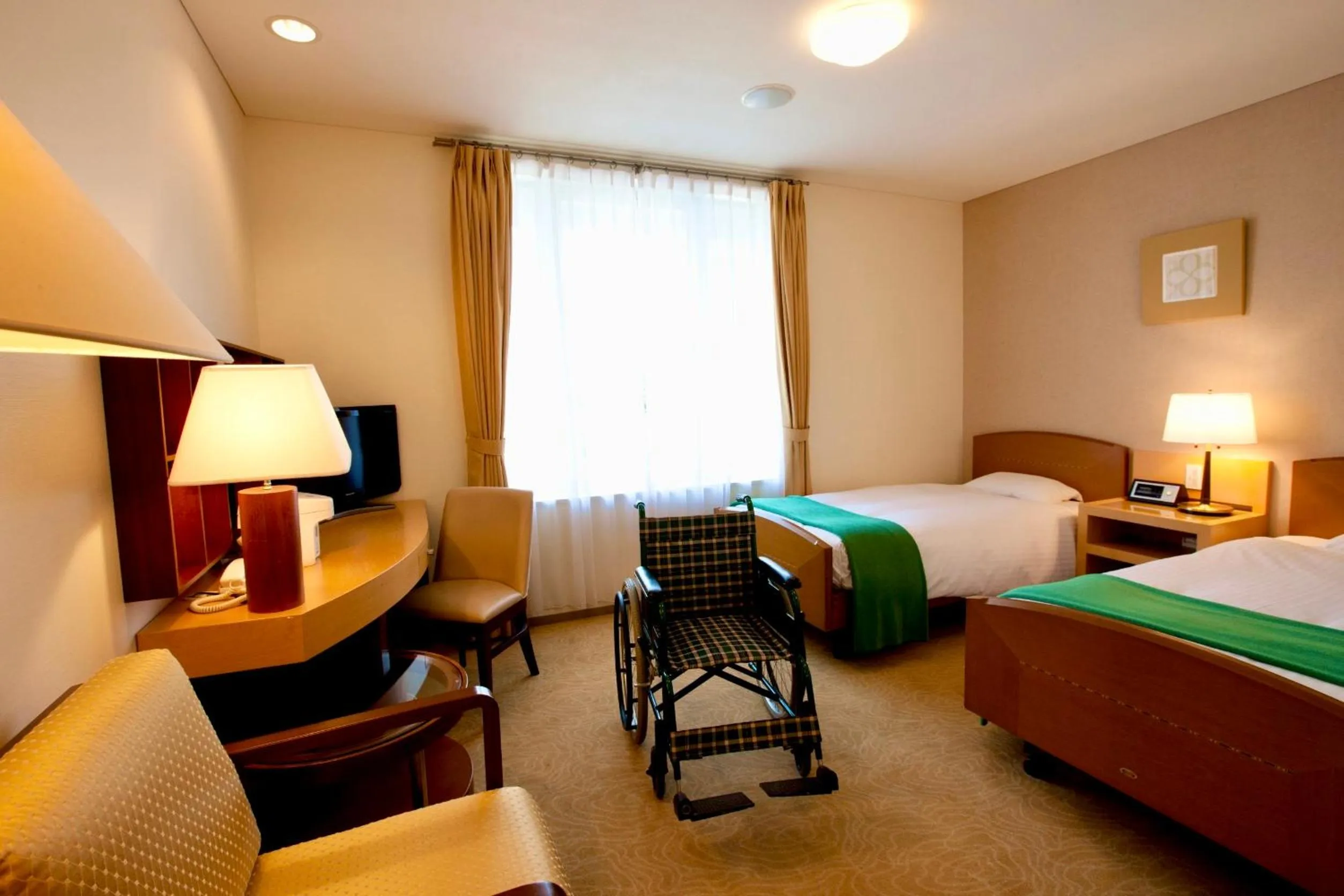 Bed in Hotel Kitano Plaza Rokkoso