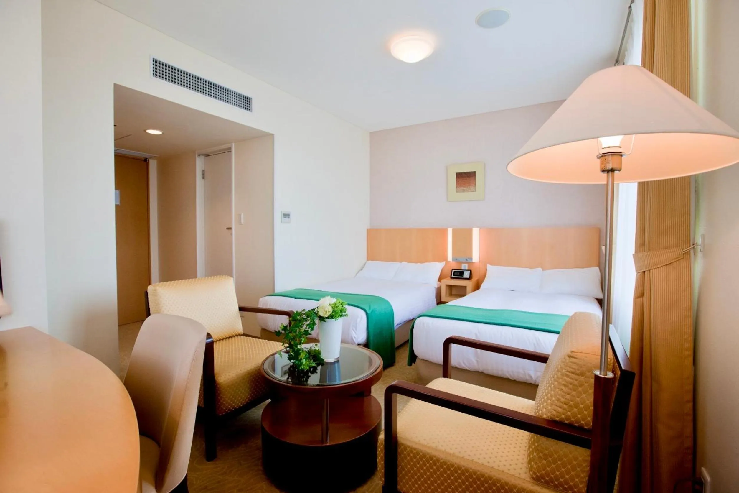 Bed in Hotel Kitano Plaza Rokkoso