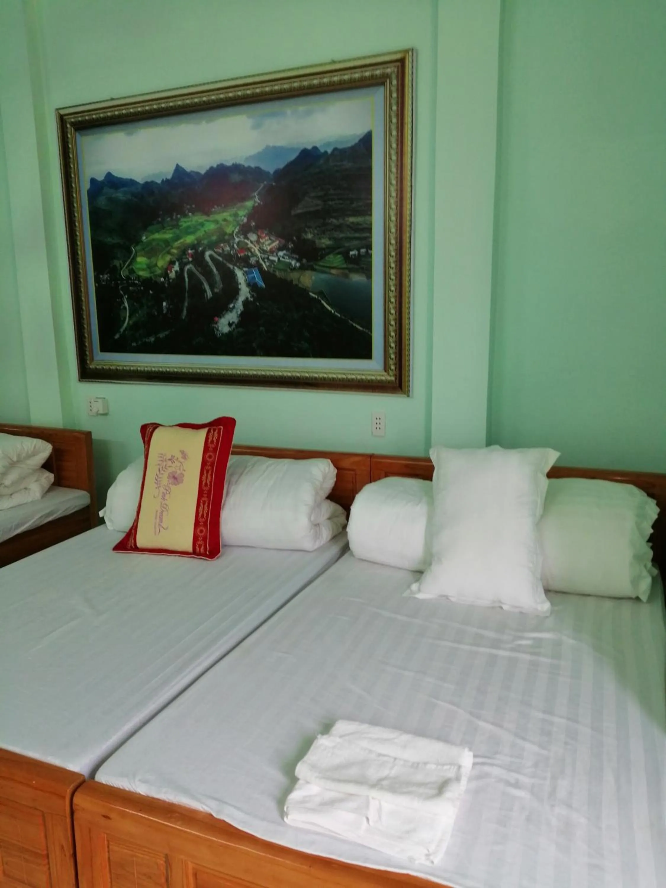 Bed in Yen Minh Hotel Thien An