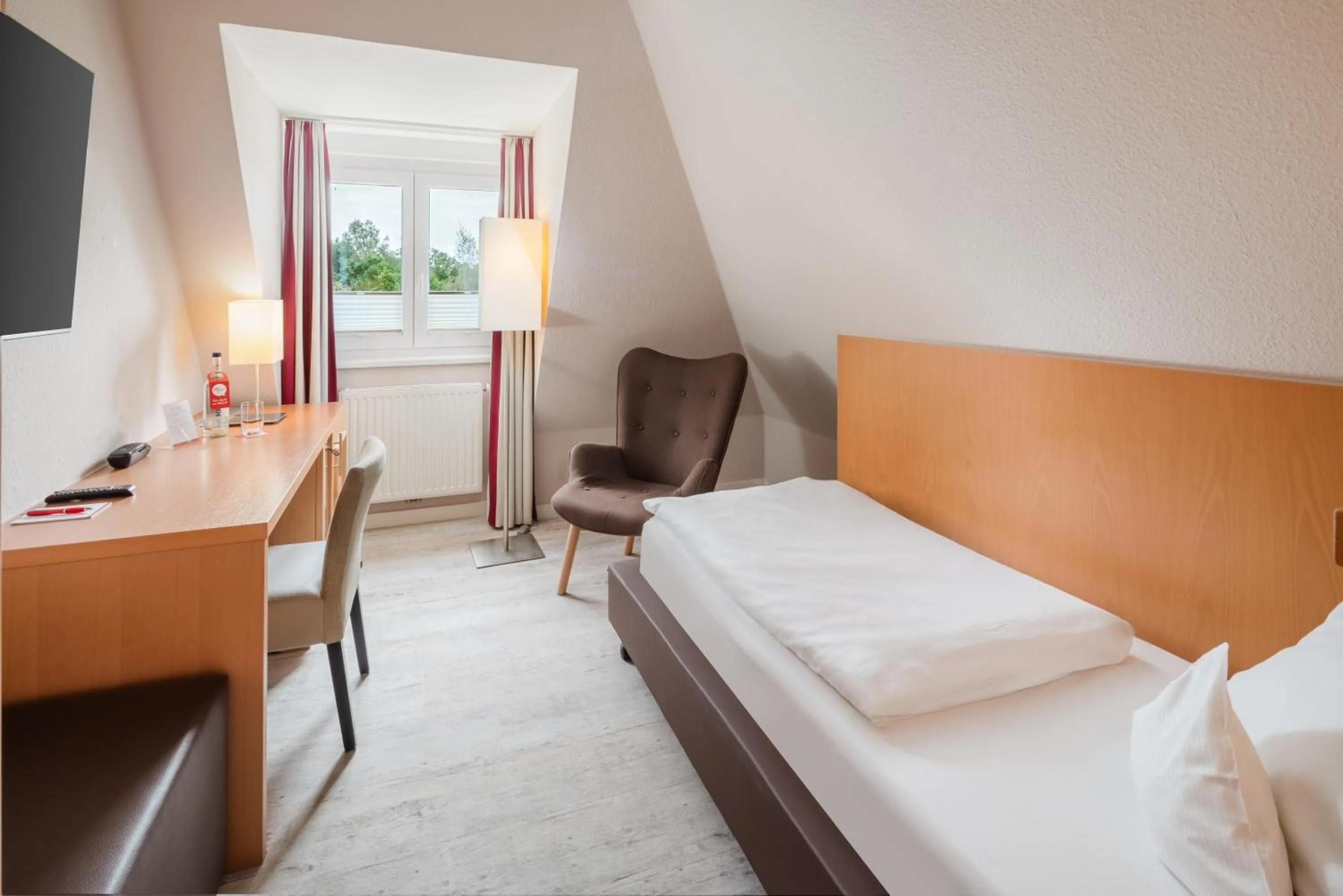 Photo of the whole room, Bed in Moin Hotel Cuxhaven