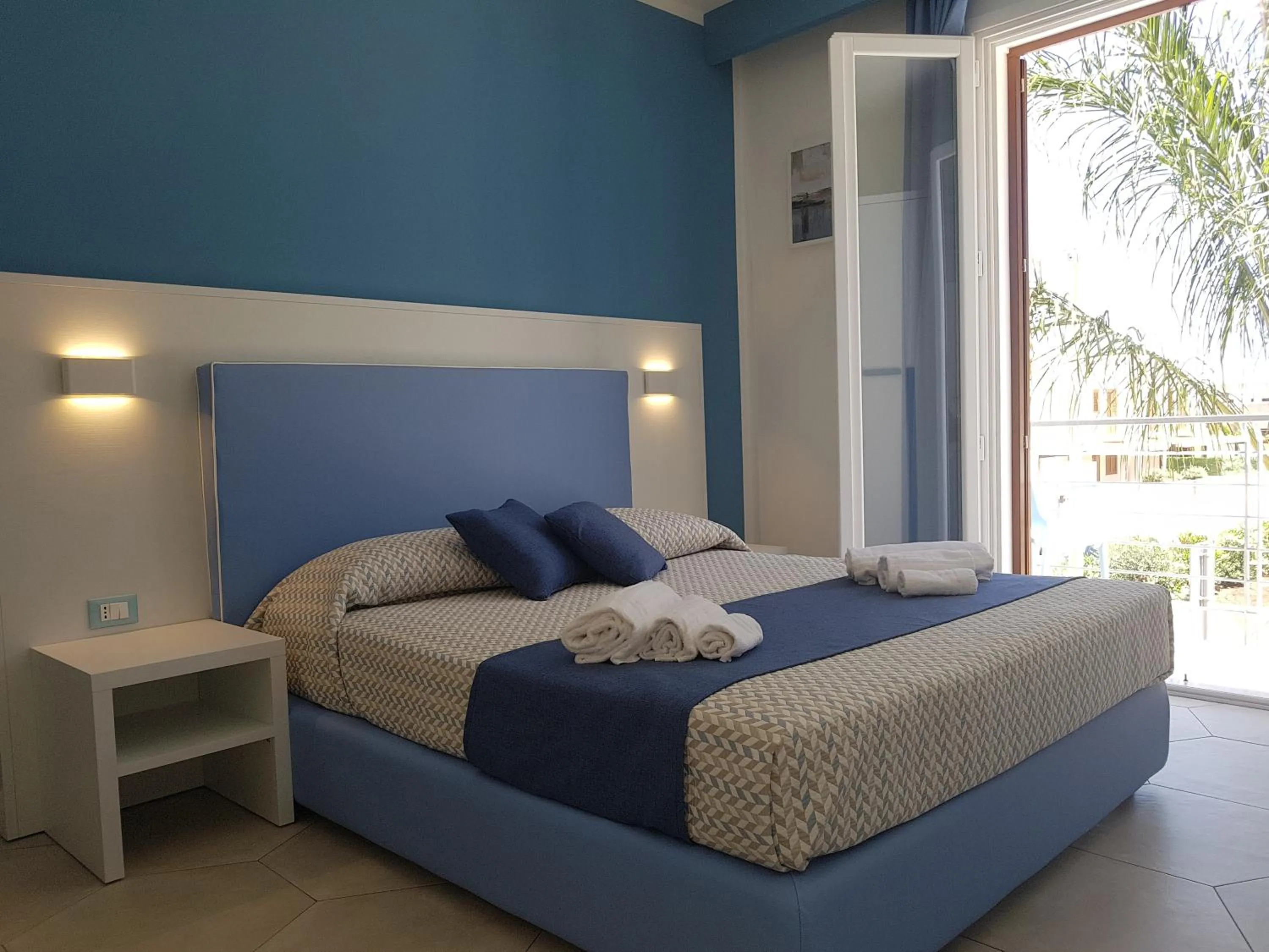 Bed in B&B Aloe Comfort Rooms