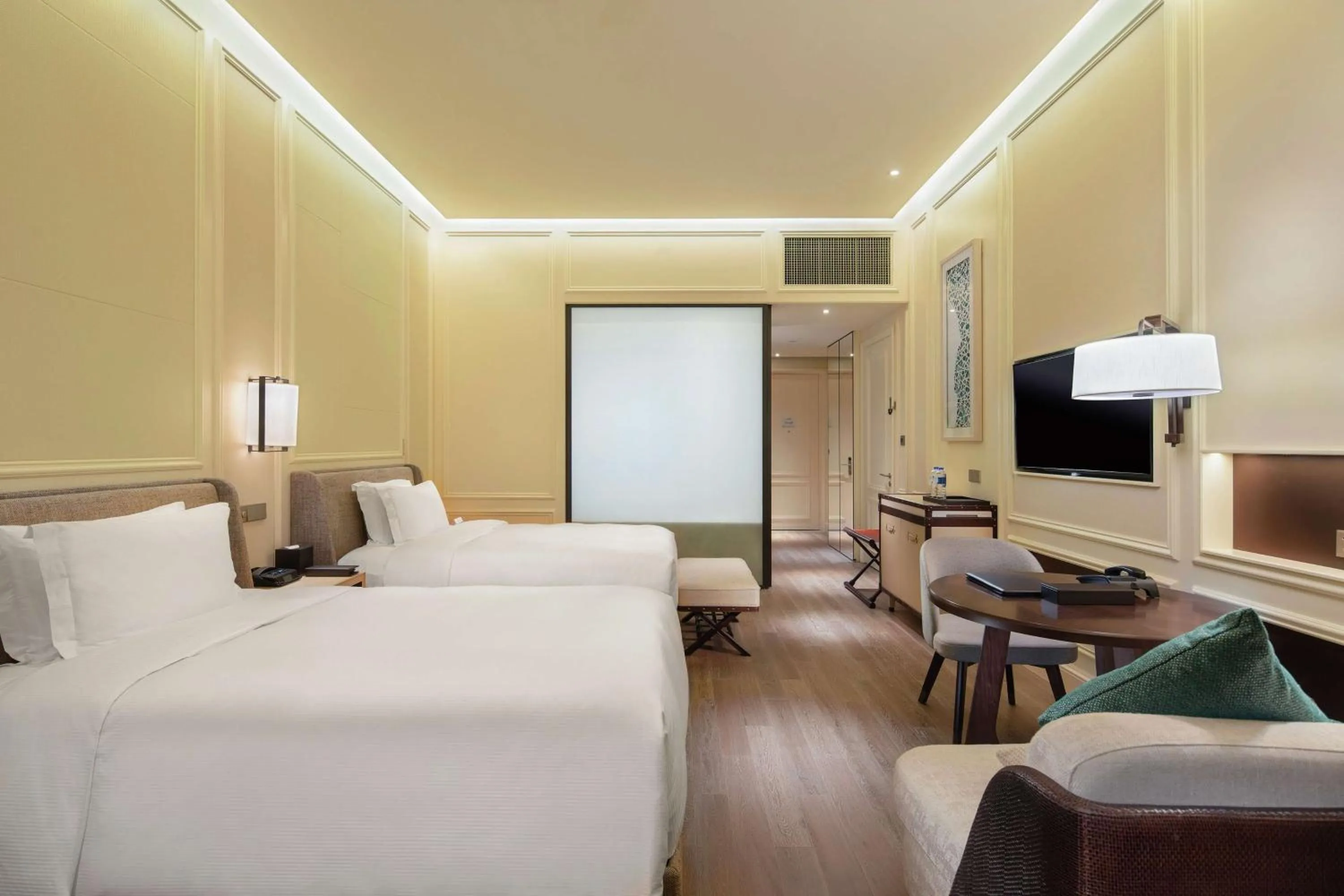 Photo of the whole room, Bed in Hilton Dalian Golden Pebble Beach Resort