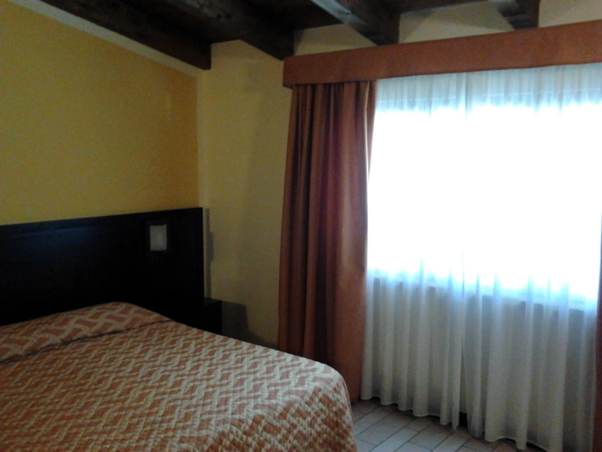 Bed in AgriHotel Papaya