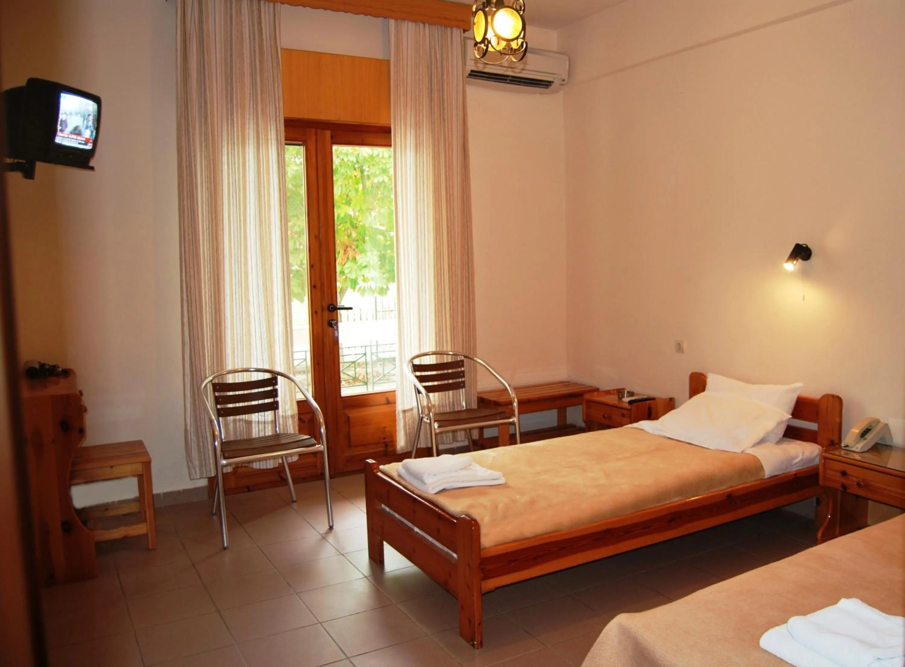 Bed in Yannis Hotel
