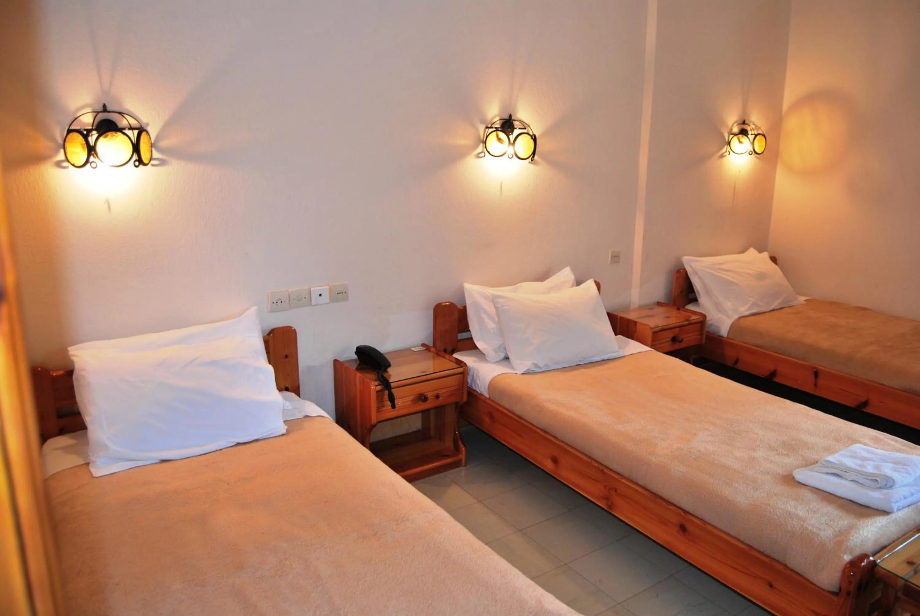 Bed in Yannis Hotel