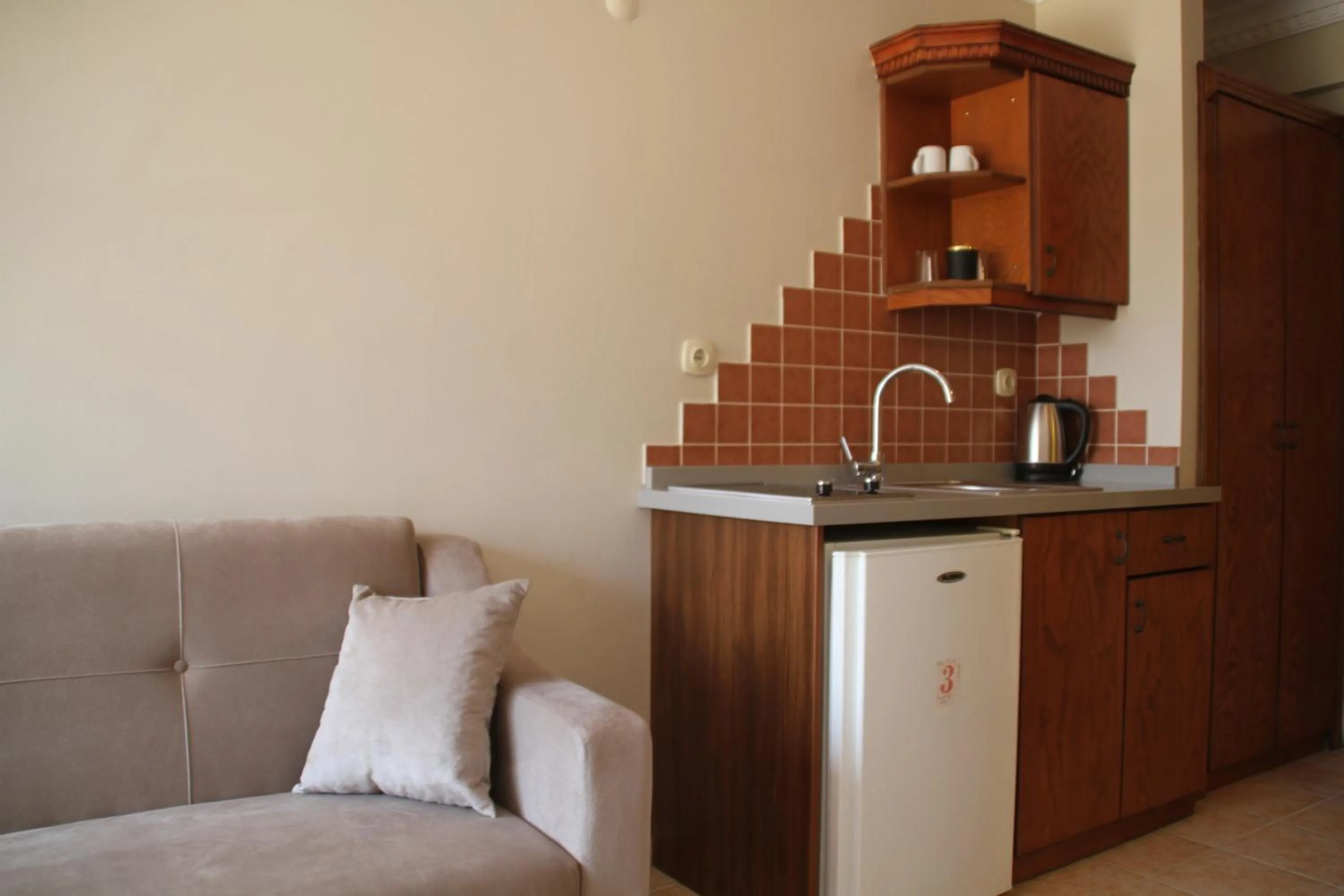 Kitchen or kitchenette in Rosy Suites Hotel