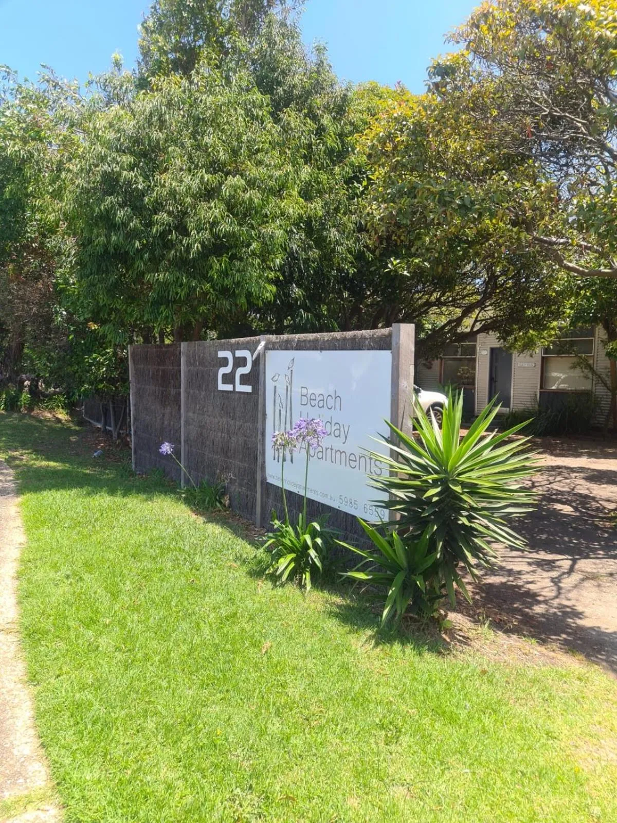 Property logo or sign in Beach Holiday Apartments