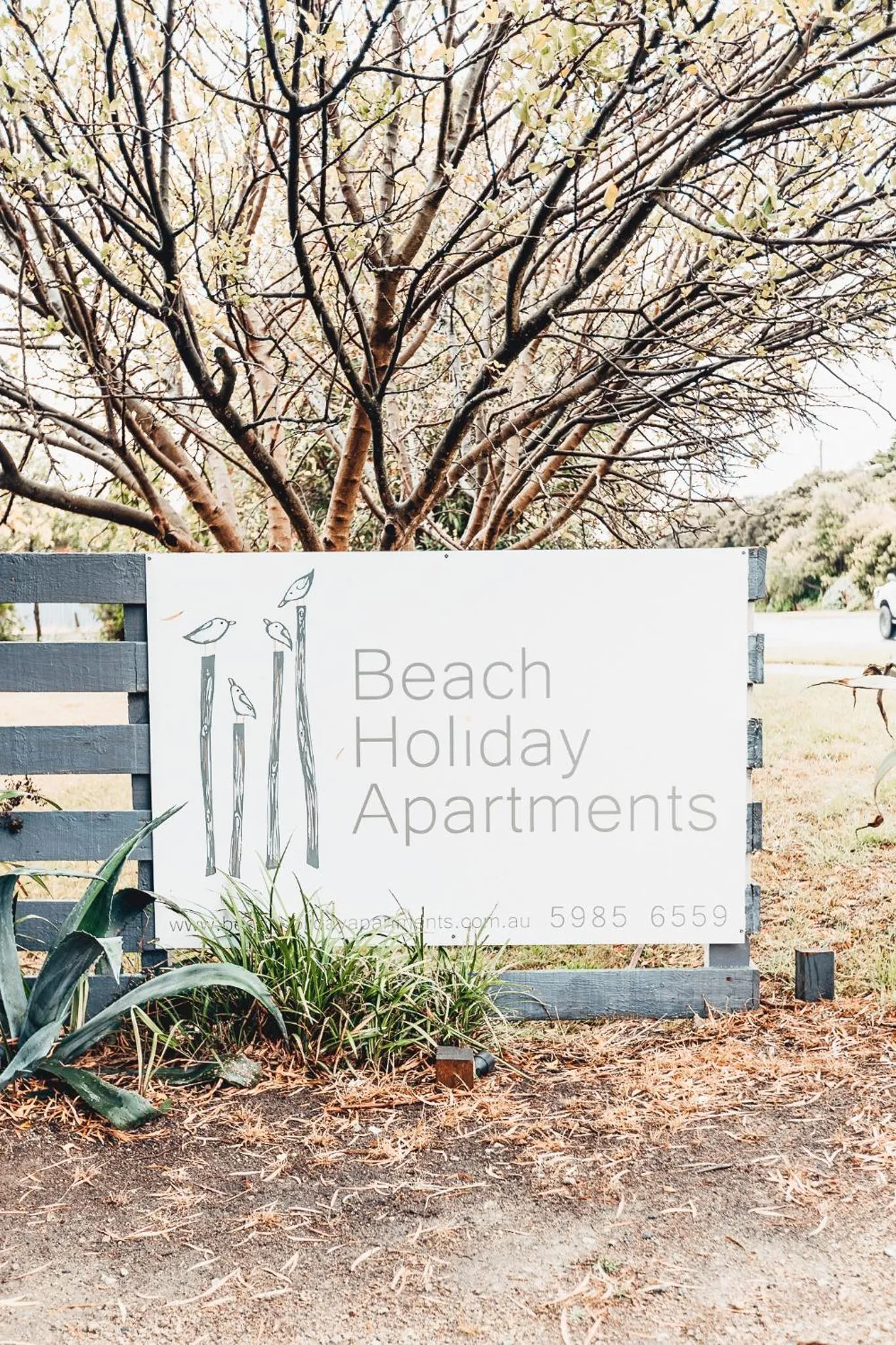 Property logo or sign in Beach Holiday Apartments