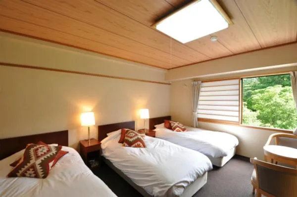 Bed in Hakuba Yamano Hotel