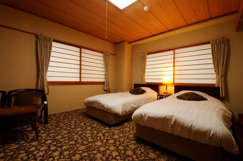 Bed in Hakuba Yamano Hotel