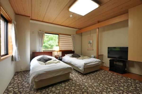 Bed in Hakuba Yamano Hotel