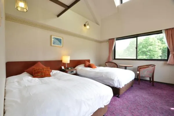 Bed in Hakuba Yamano Hotel