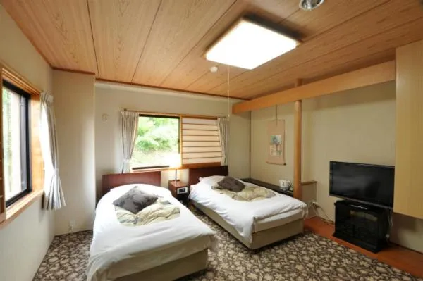 Bed in Hakuba Yamano Hotel