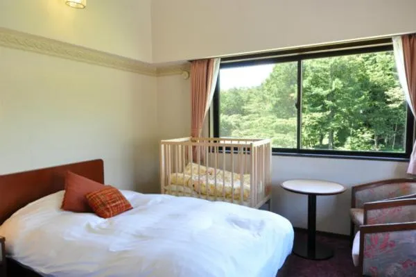 Bed in Hakuba Yamano Hotel