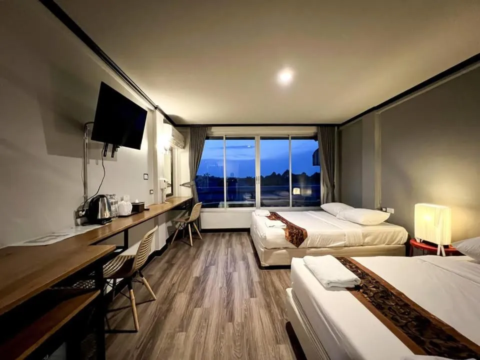 Bed in Pimpimarn Hotel