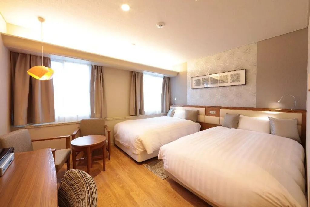 Bed in Tottori Onsen Hotel Monarque Tottori