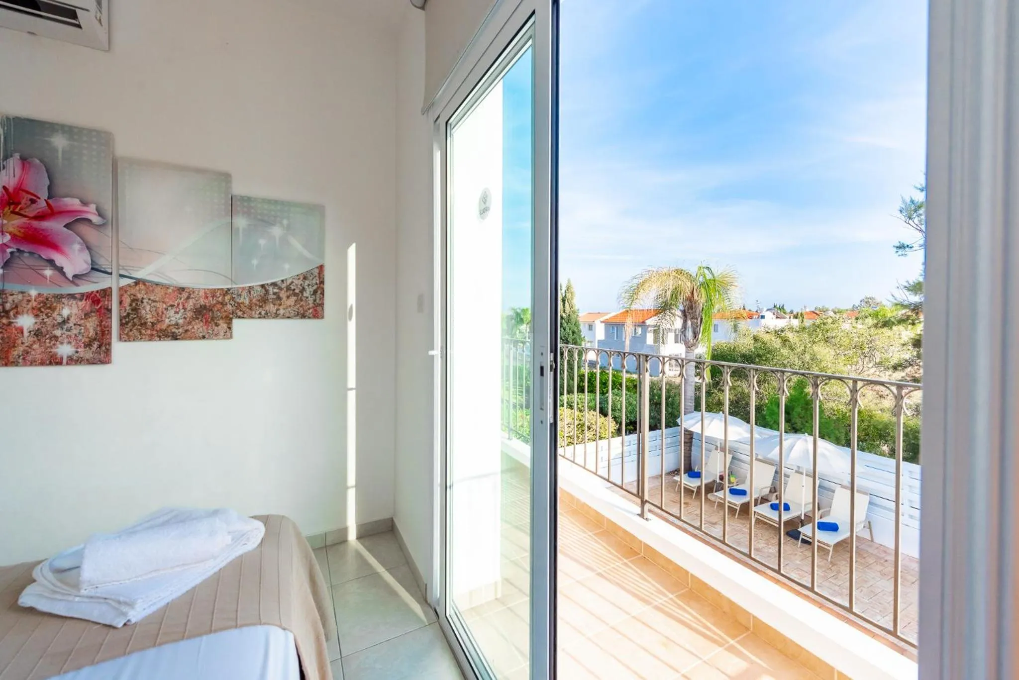 Bed in Villa Palm Breeze by Ezoria Villas