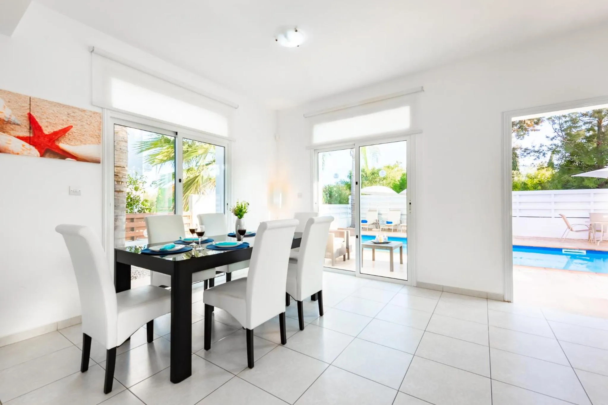 Dining area in Villa Palm Breeze by Ezoria Villas