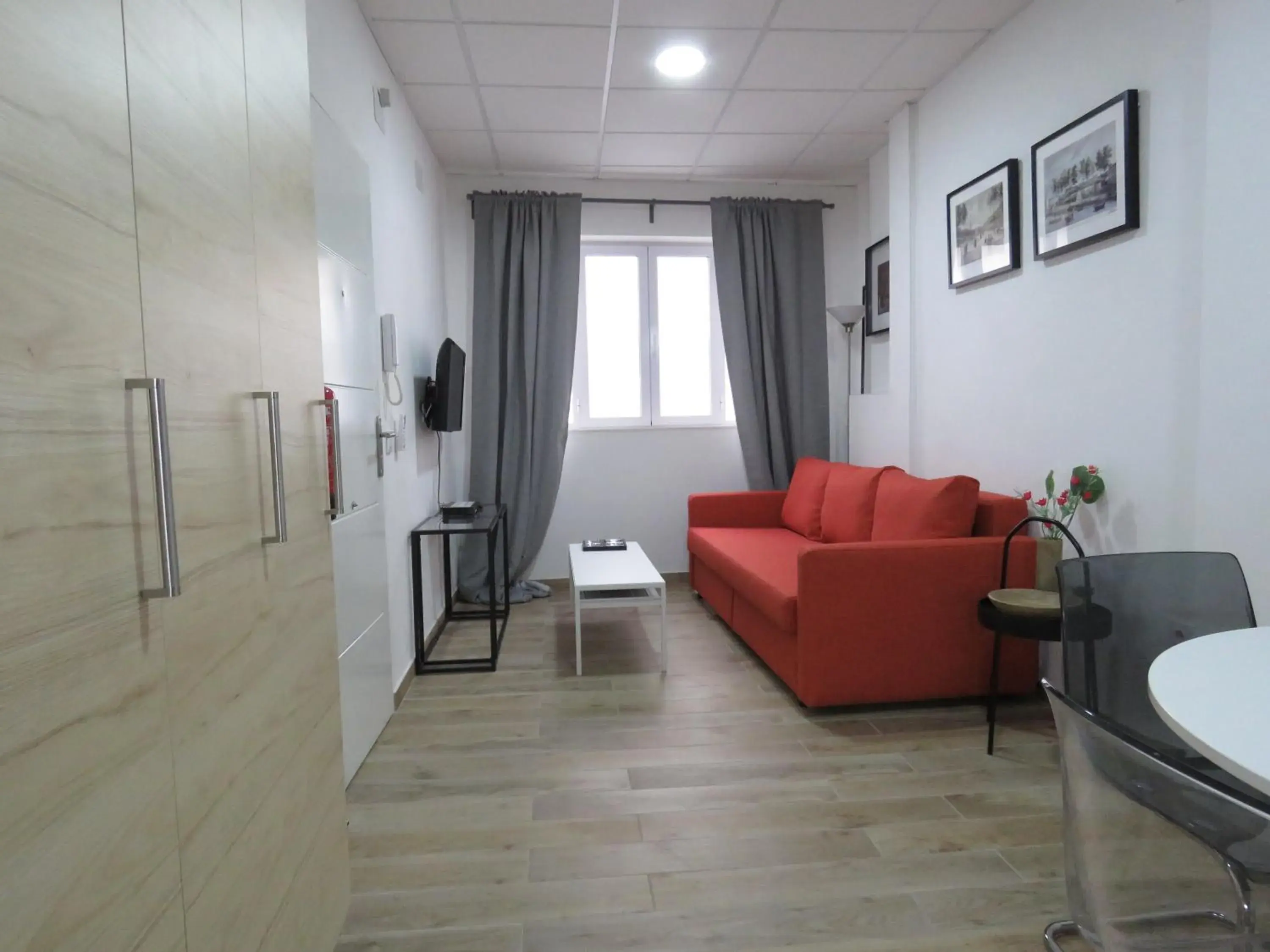 Living room in Living Sevilla Apartments Hércules Living room in Living Sevilla Apartments Hércules