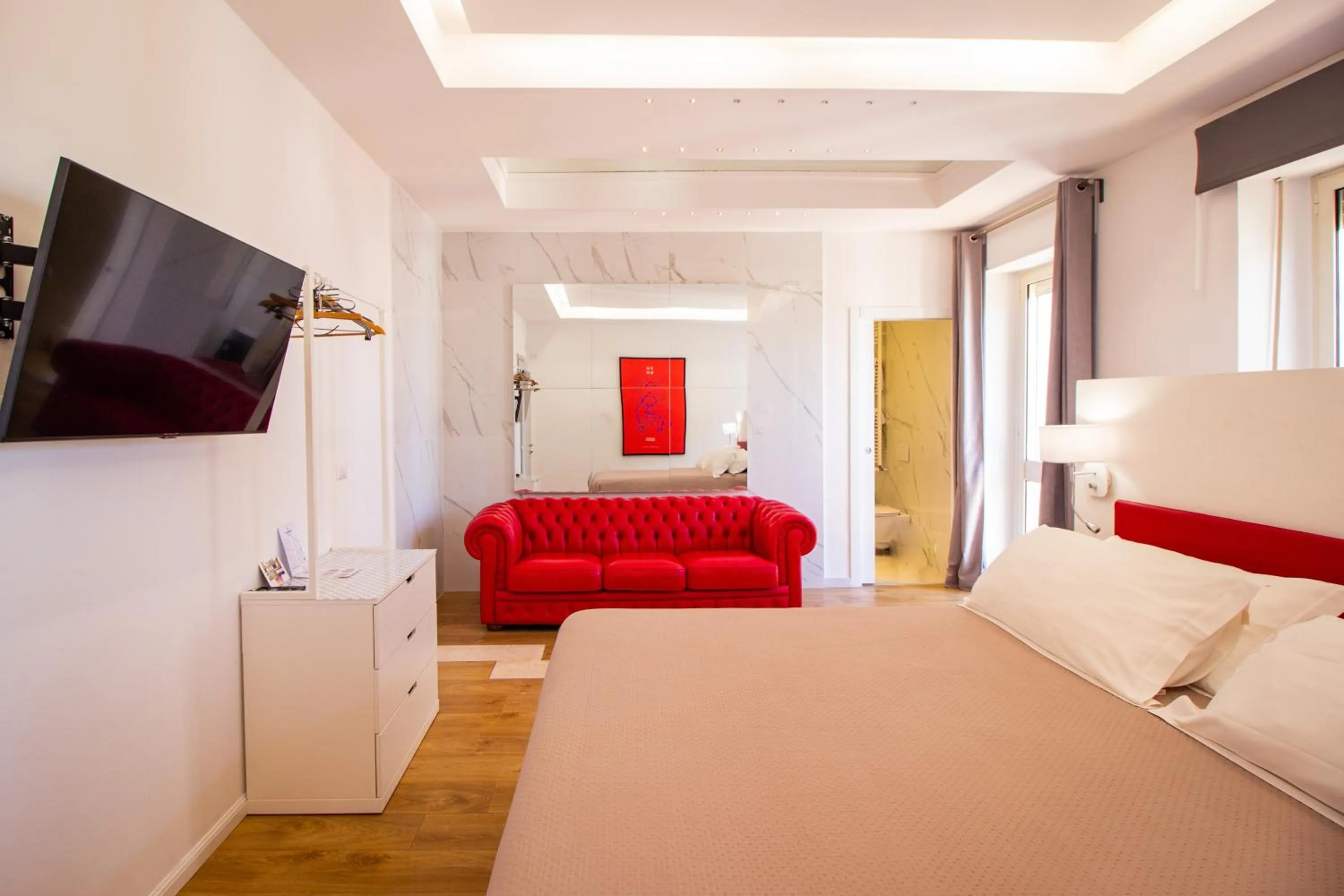 Communal lounge/ TV room, Bed in Album Boutique Rooms