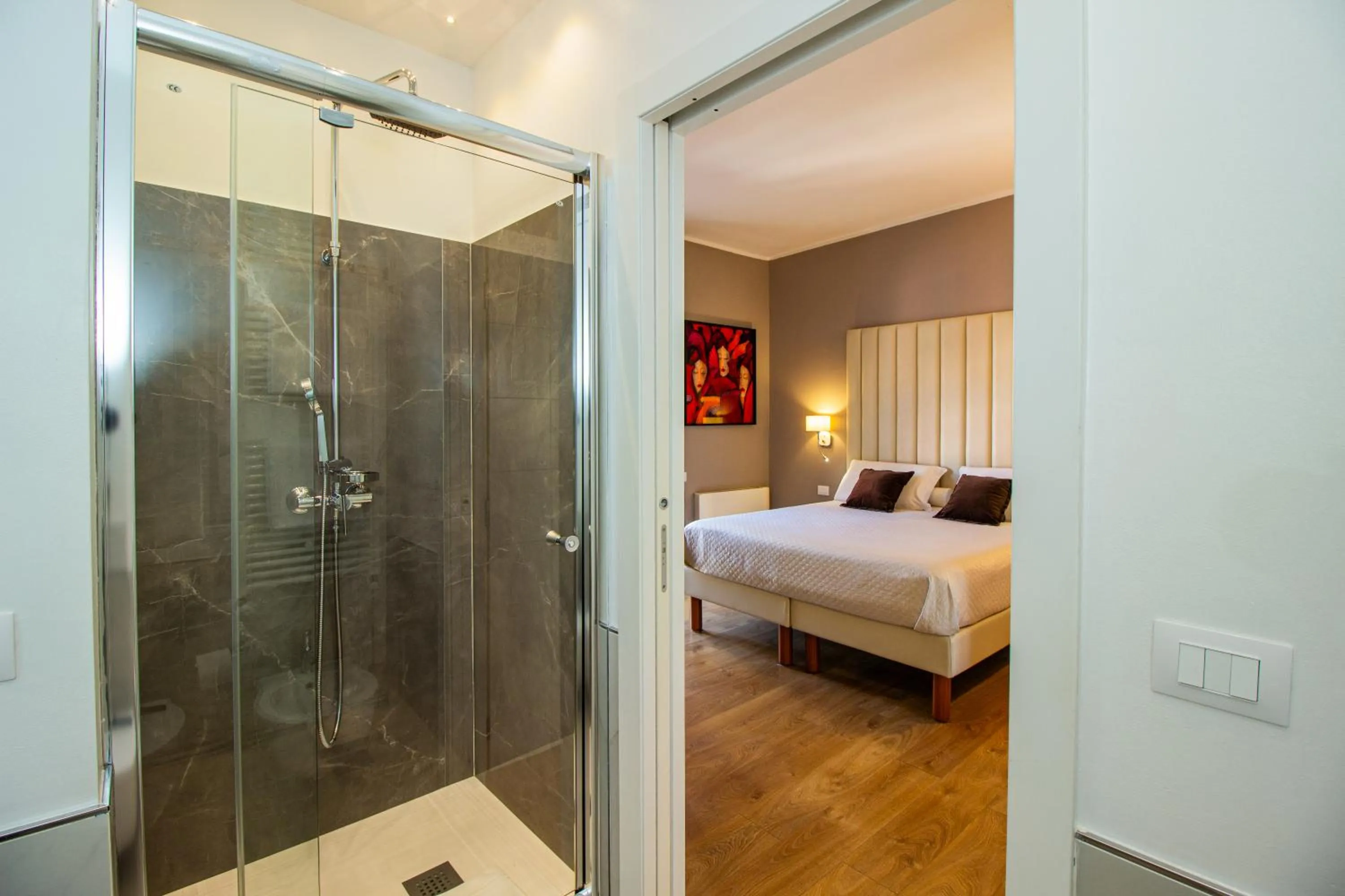 Shower, Bed in Album Boutique Rooms