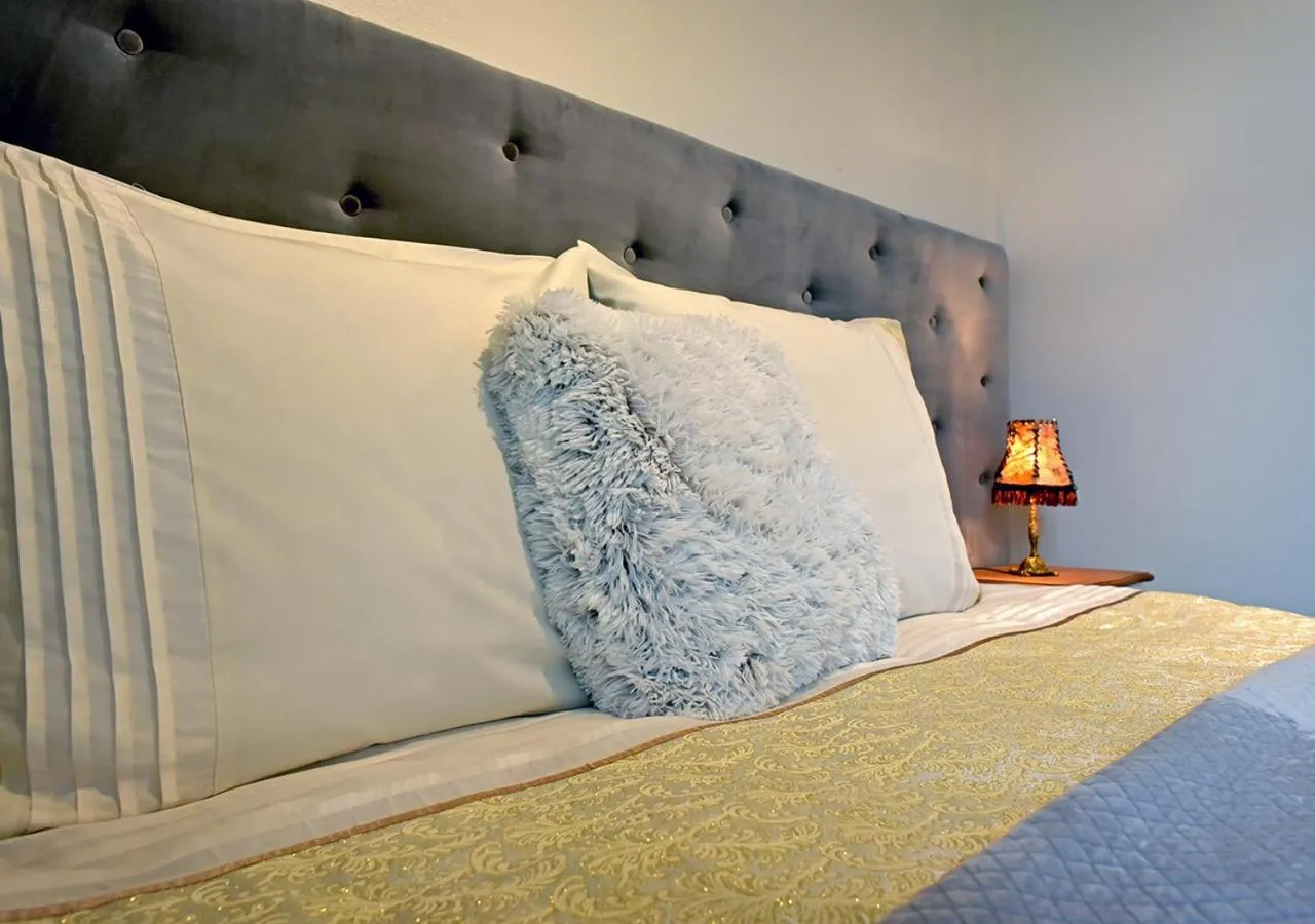 Bed in Dali ApartHOTEL