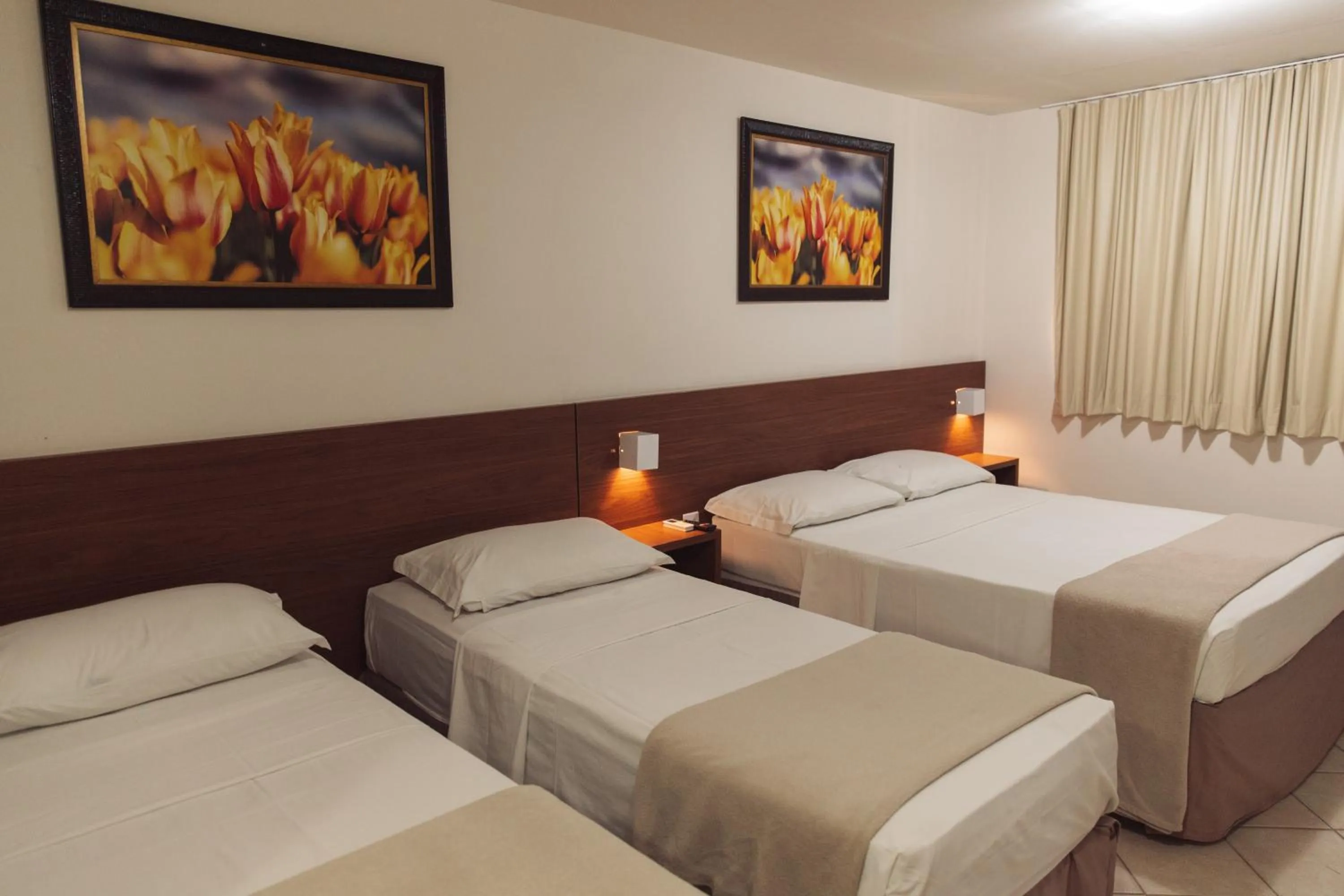 Bed in Pousada Laranja - Nova Administração