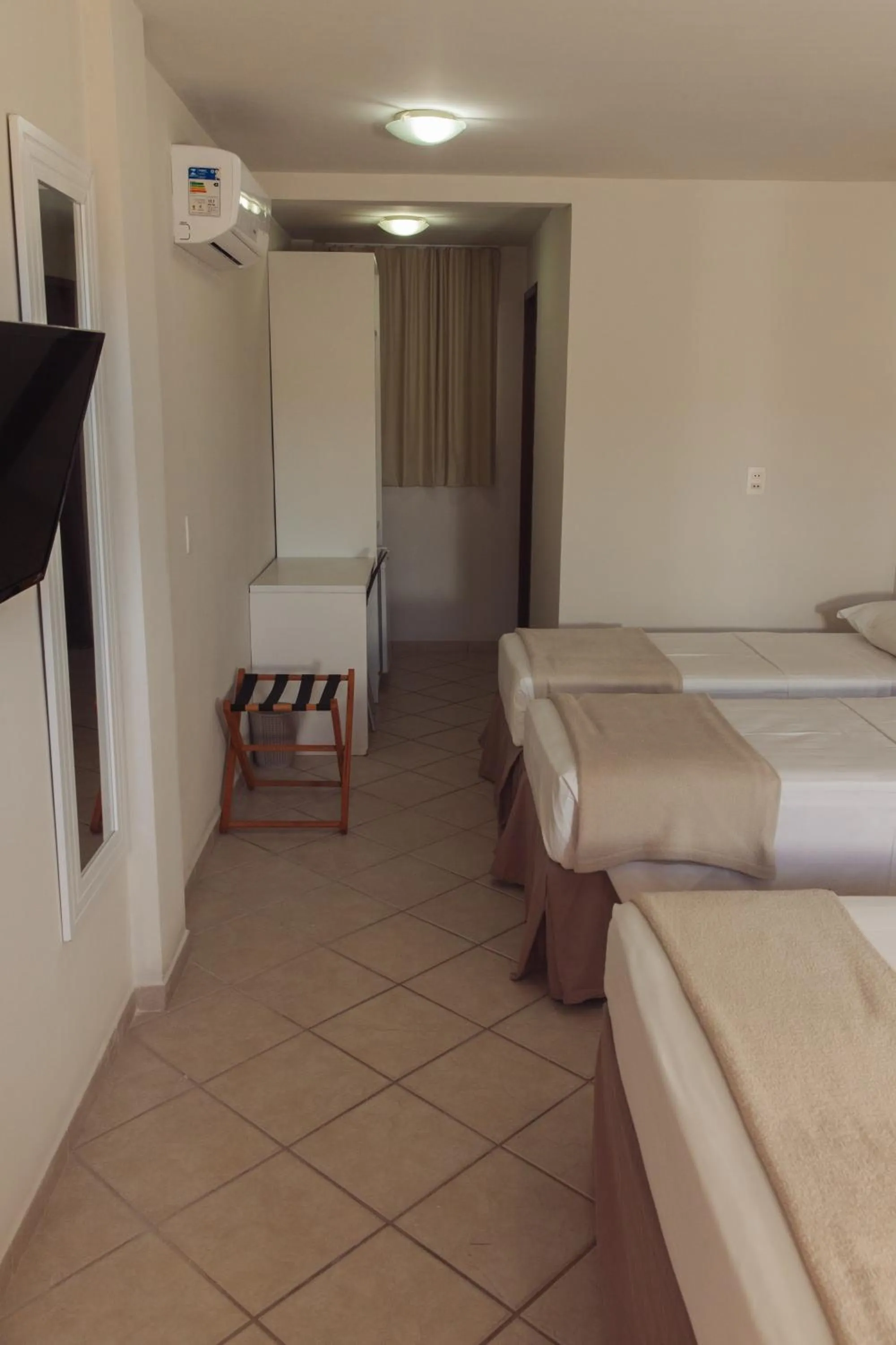 Bed in Pousada Laranja - Nova Administração