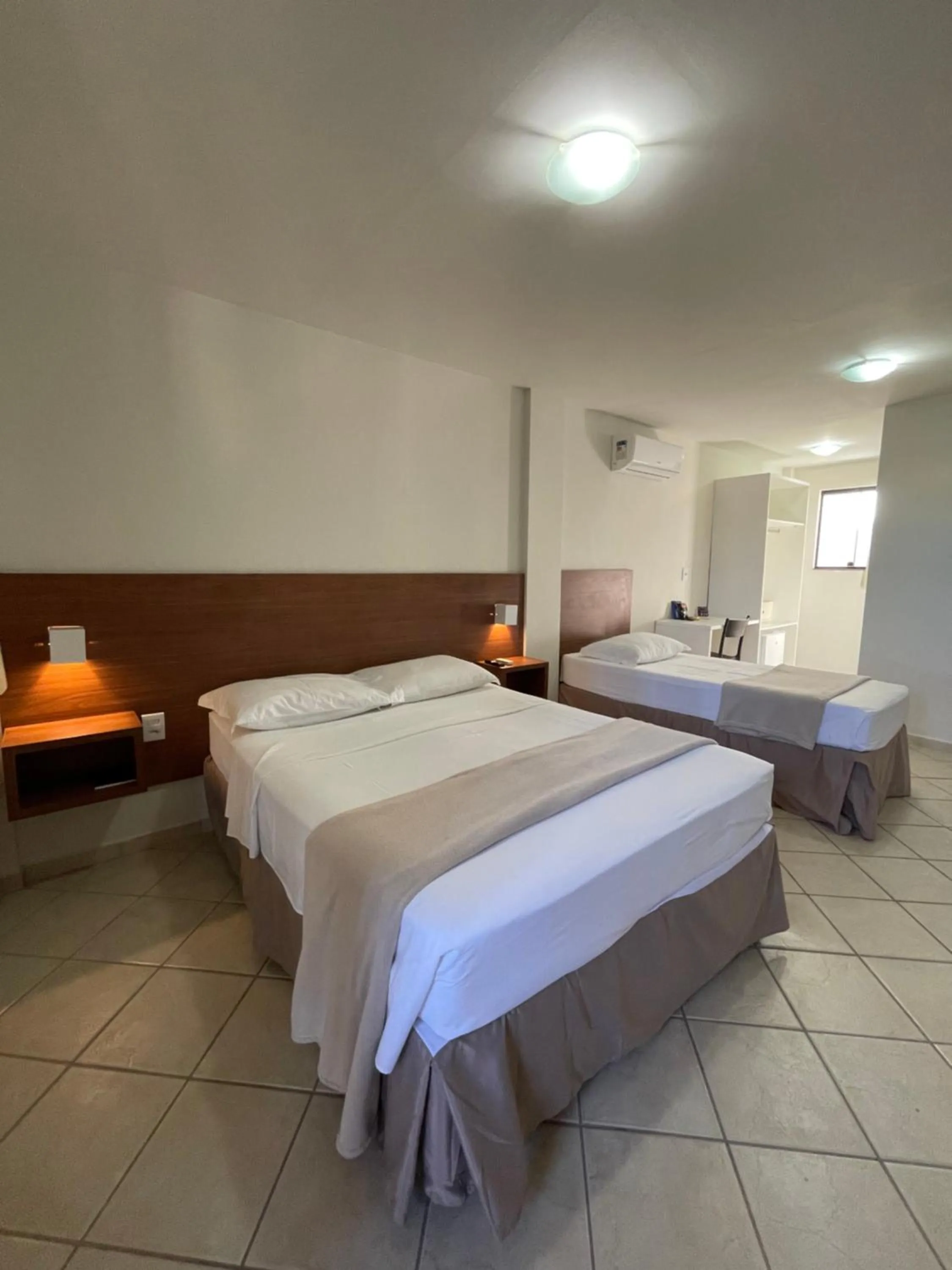 Bed in Pousada Laranja - Nova Administração